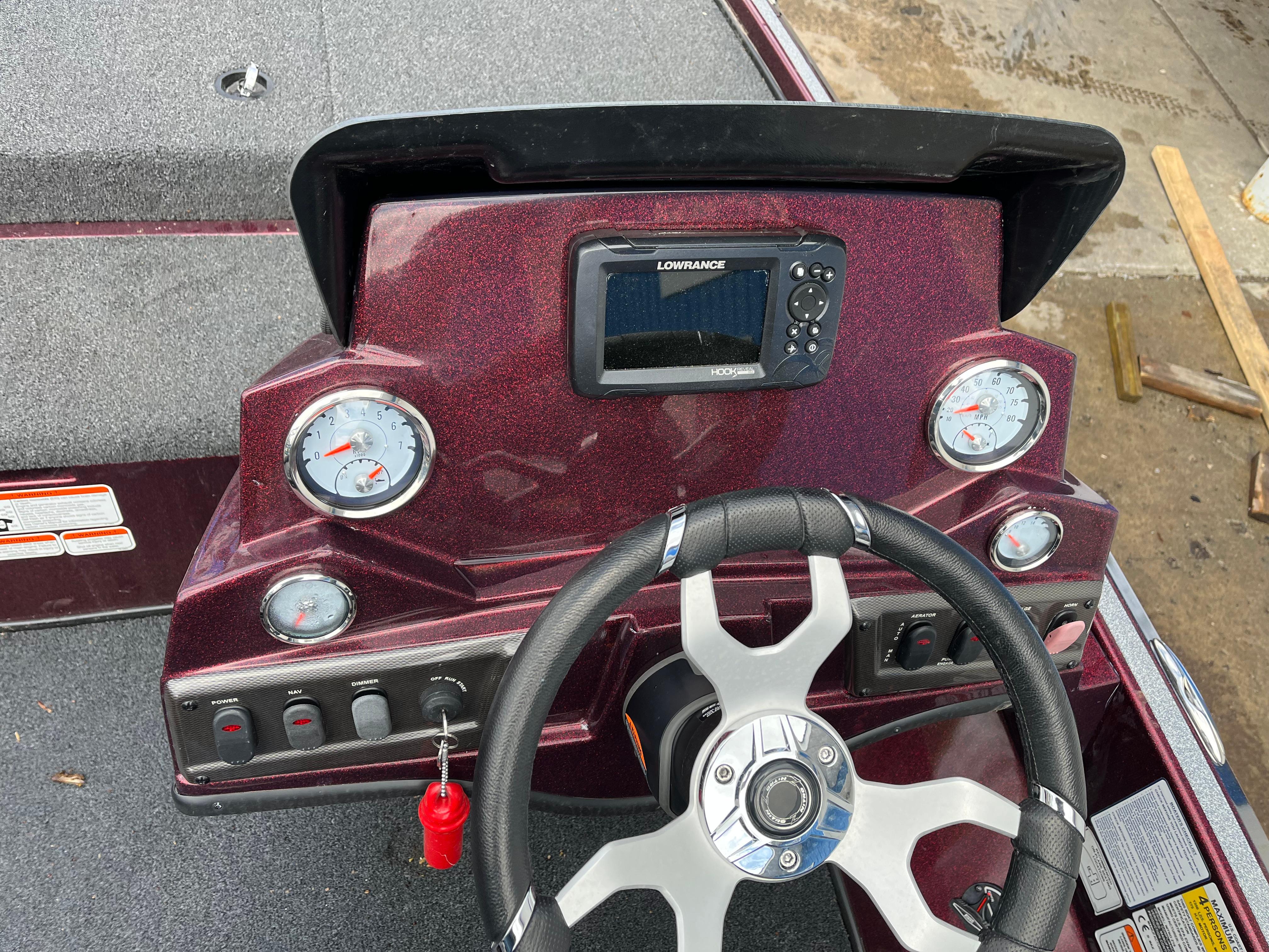 Dashboard of a 2022 Nitro Z18 boat with steering wheel and gauges.