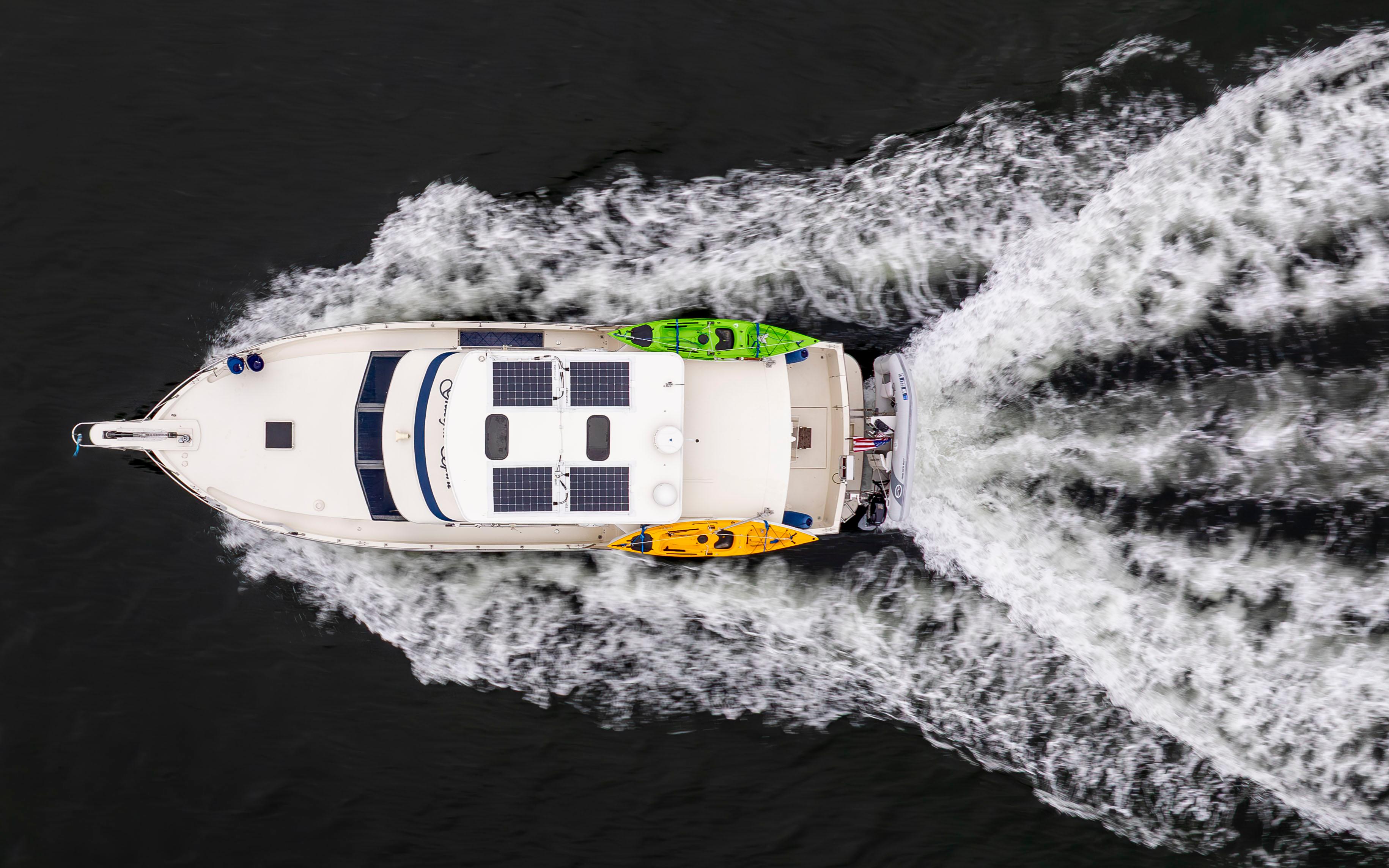 Tollycraft-44 Cockpit Motor Yacht 1990-Graceful Spirit WA-US-Overhead view of 1990 Tollycraft 44 Cockpit Motor Yacht cruising with kayaks.-9844071 | Thumbnail