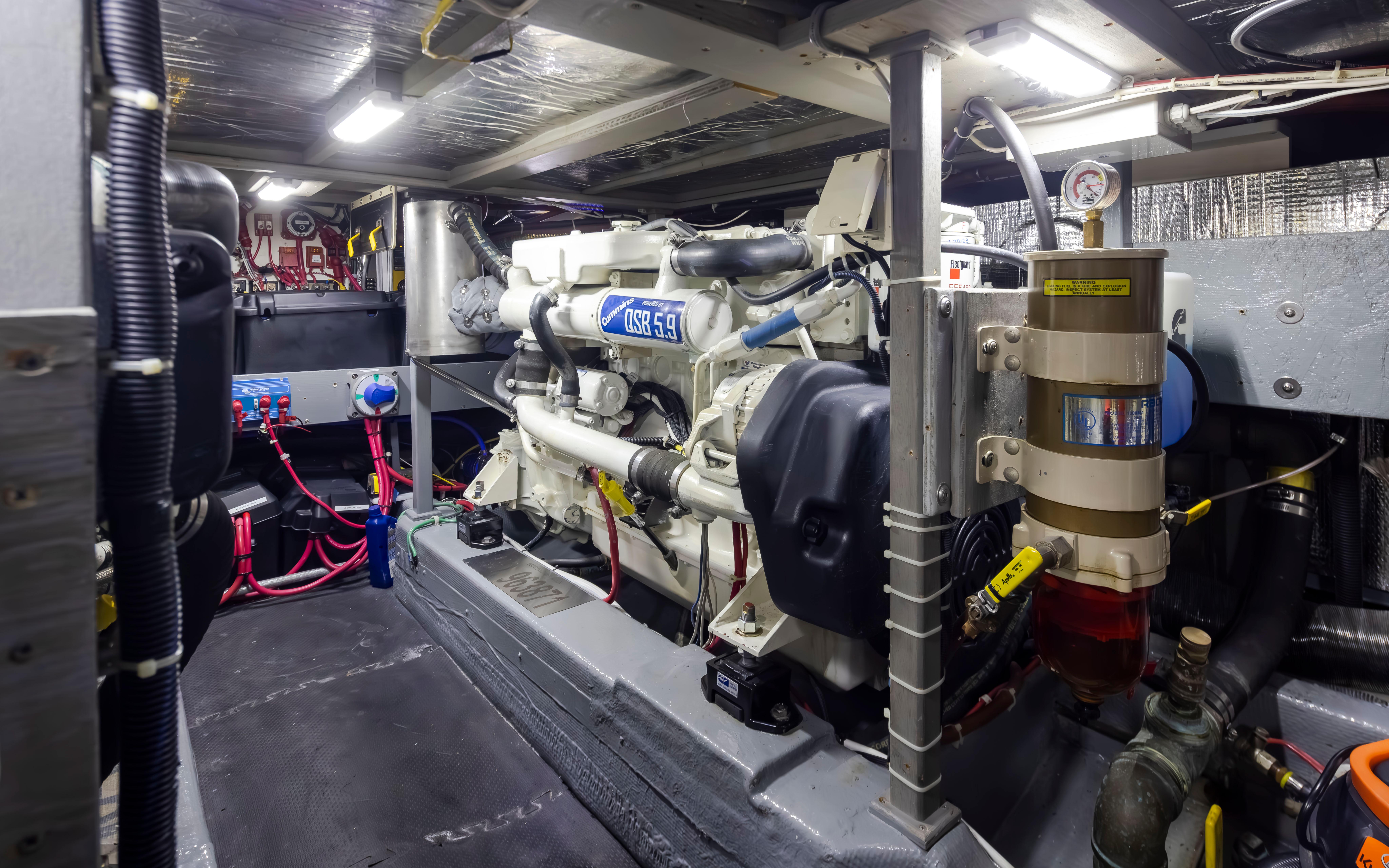 Tollycraft-44 Cockpit Motor Yacht 1990-Graceful Spirit WA-US-Engine room of 1990 Tollycraft 44 Cockpit Motor Yacht, showcasing mechanical components and wiring.-9844071 | Thumbnail