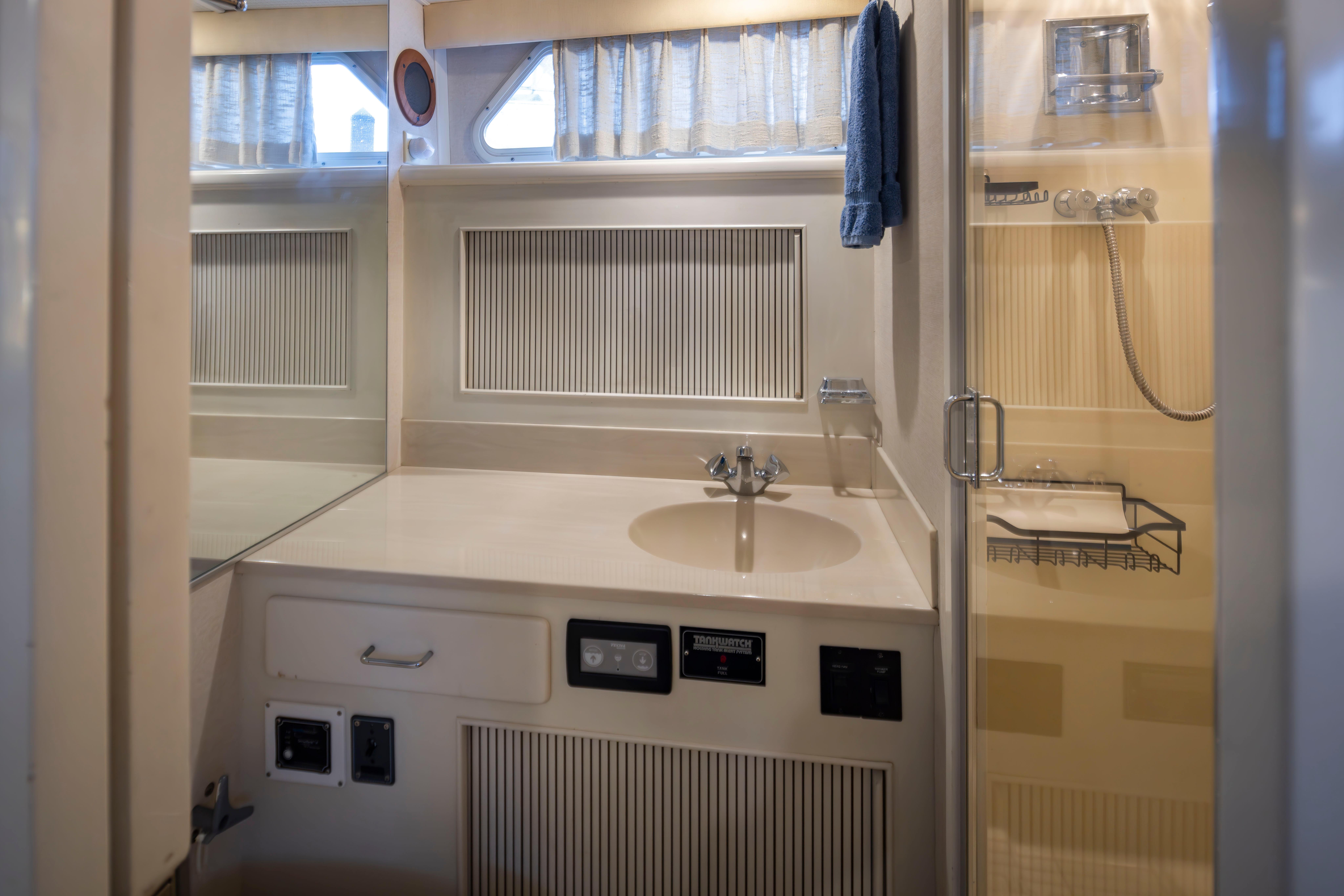 Tollycraft-44 Cockpit Motor Yacht 1990-Graceful Spirit WA-US-1990 Tollycraft 44 Cockpit Motor Yacht bathroom with sink, shower, and storage.-9844071 | Thumbnail