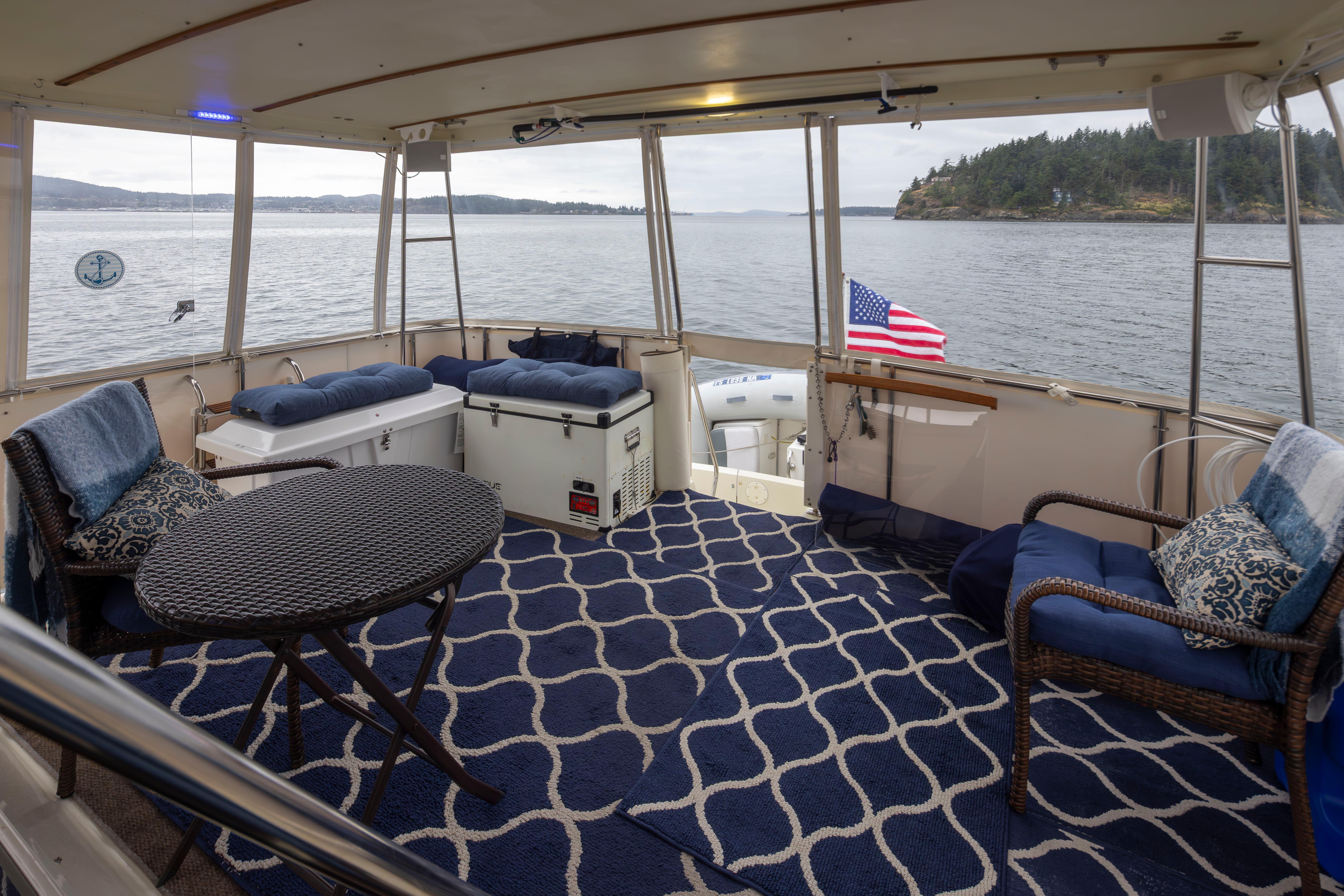 Tollycraft-44 Cockpit Motor Yacht 1990-Graceful Spirit WA-US-1990 Tollycraft 44 Cockpit Motor Yacht interior with seating, table, and ocean view.-9844071 | Thumbnail