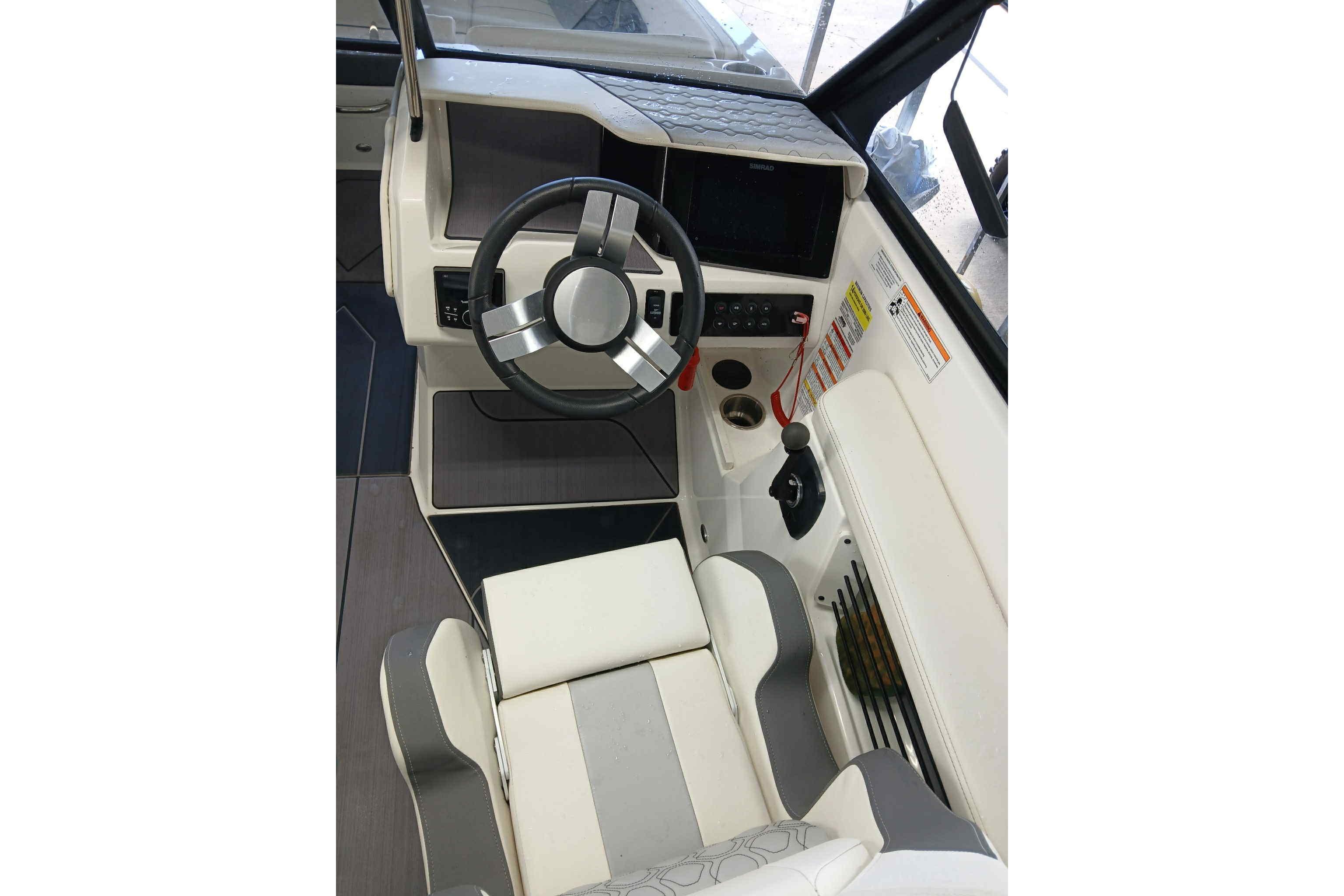 2023 Heyday H22 boat interior with steering wheel and control panel.
