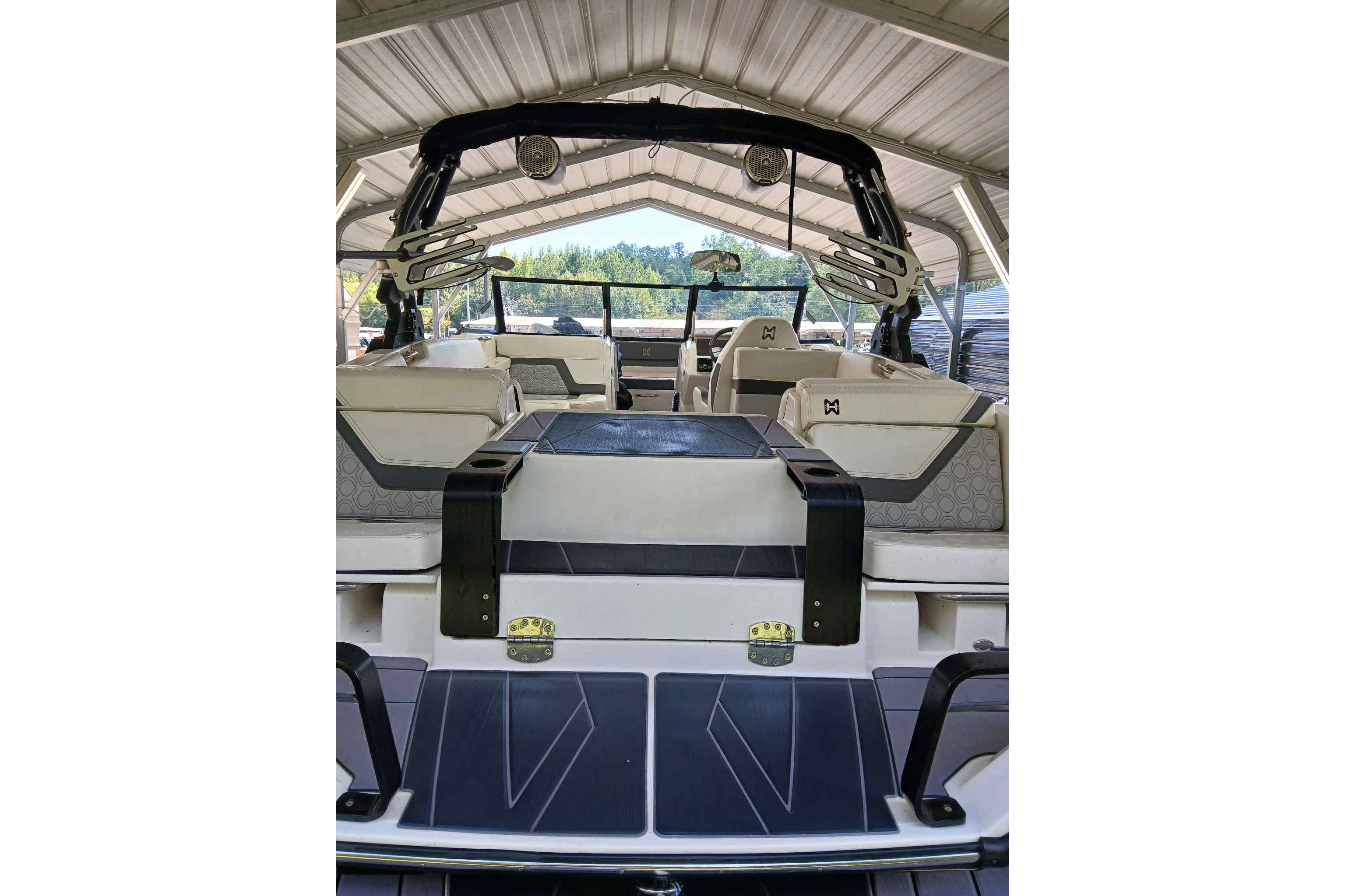 2023 Heyday H22 boat interior under a metal canopy, showcasing seating and design.