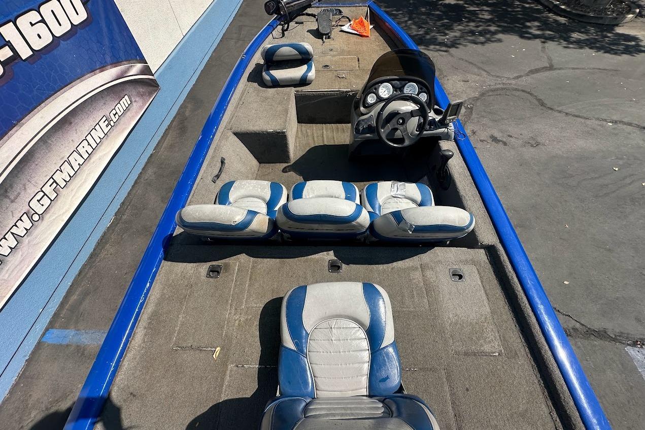 2005 Bass Tracker Pro Team 175 boat interior with blue and gray seating.