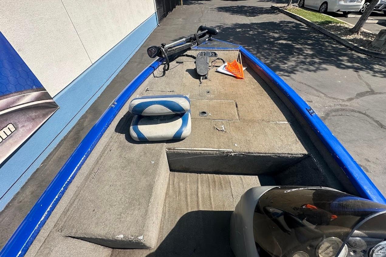 2005 Bass Tracker Pro Team 175 boat interior with blue trim and seating.
