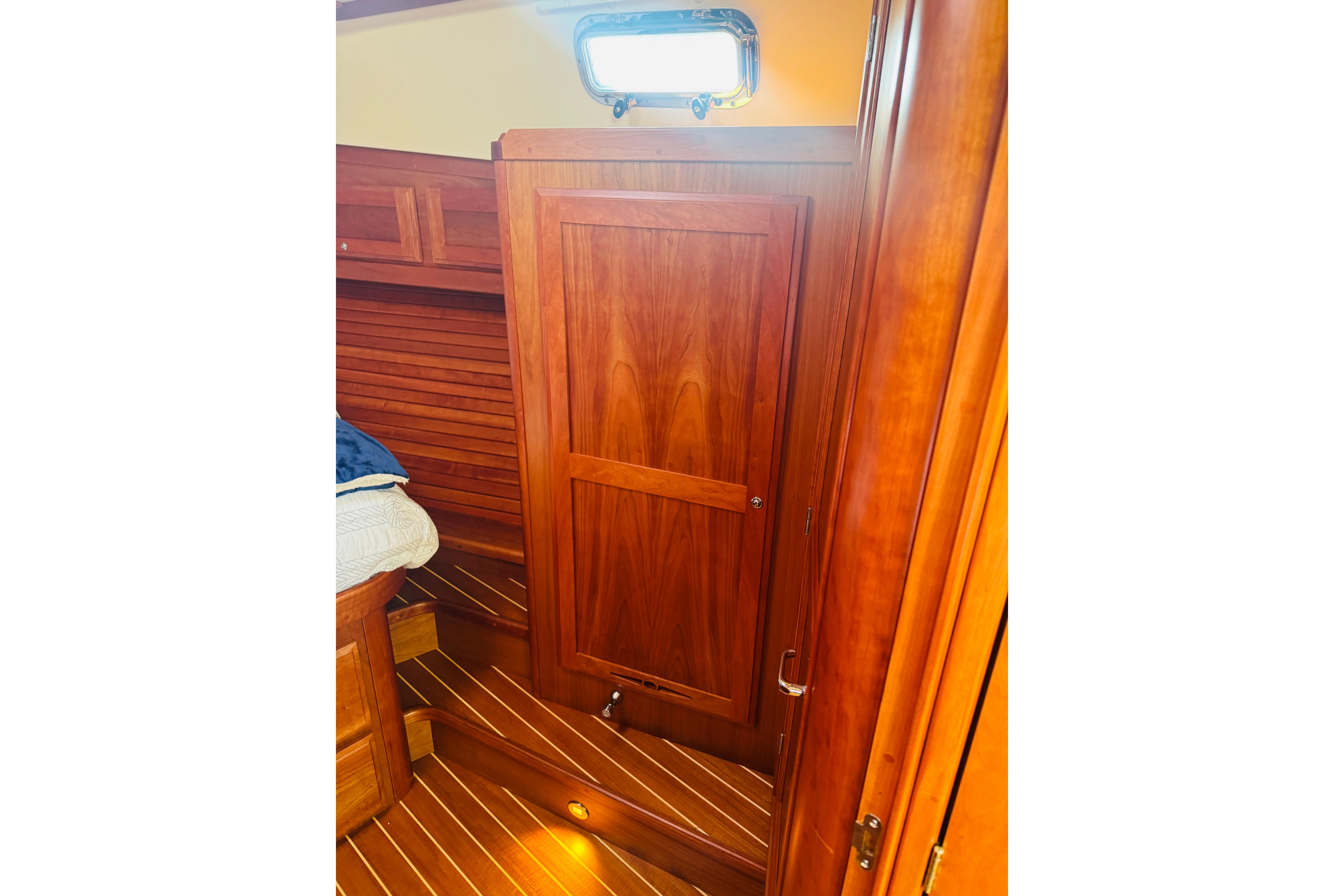 Interior of 2015 Sabre 38 Salon Express with wooden door and flooring.