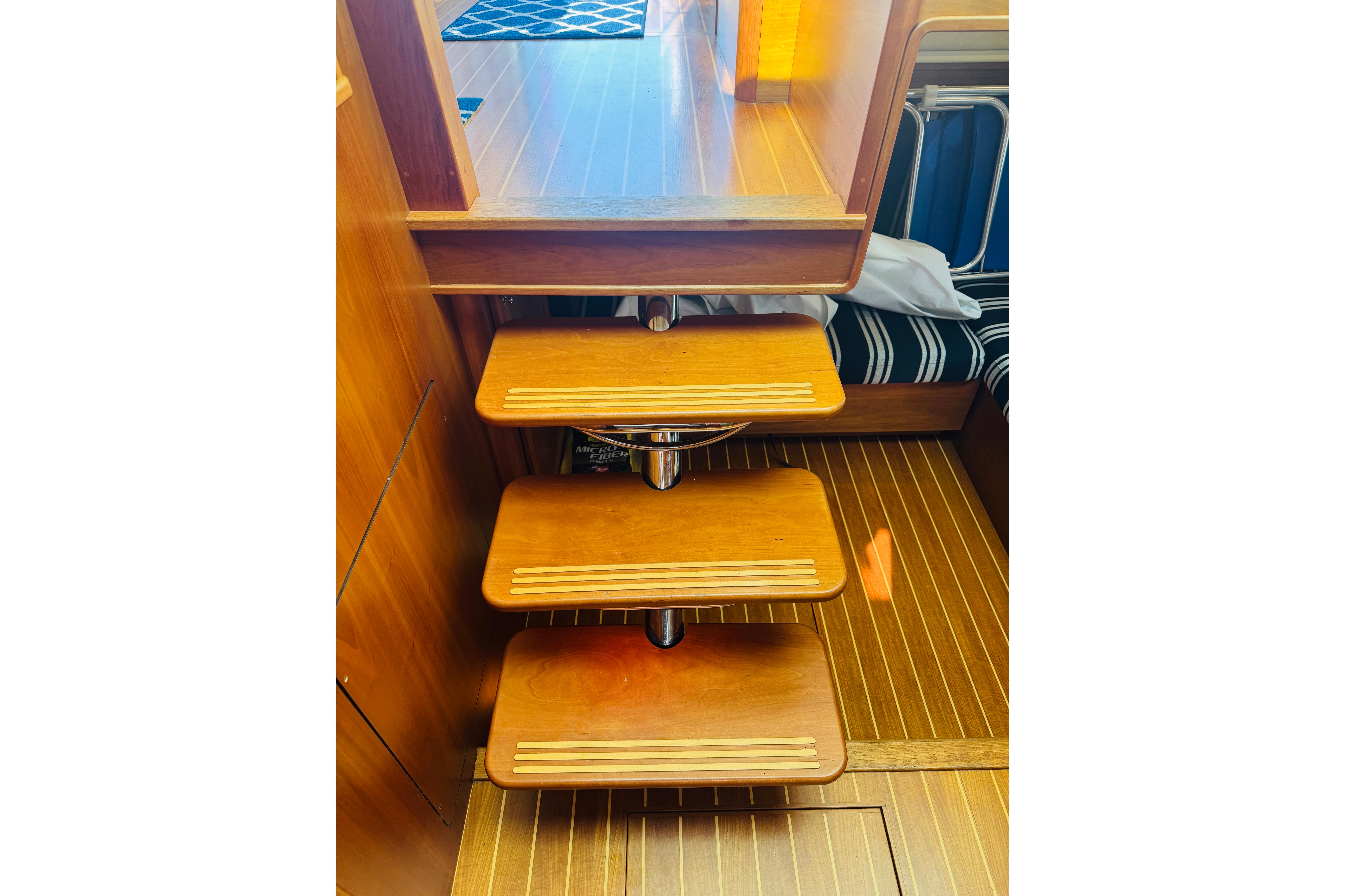 Wooden interior stairs on 2015 Sabre 38 Salon Express yacht.