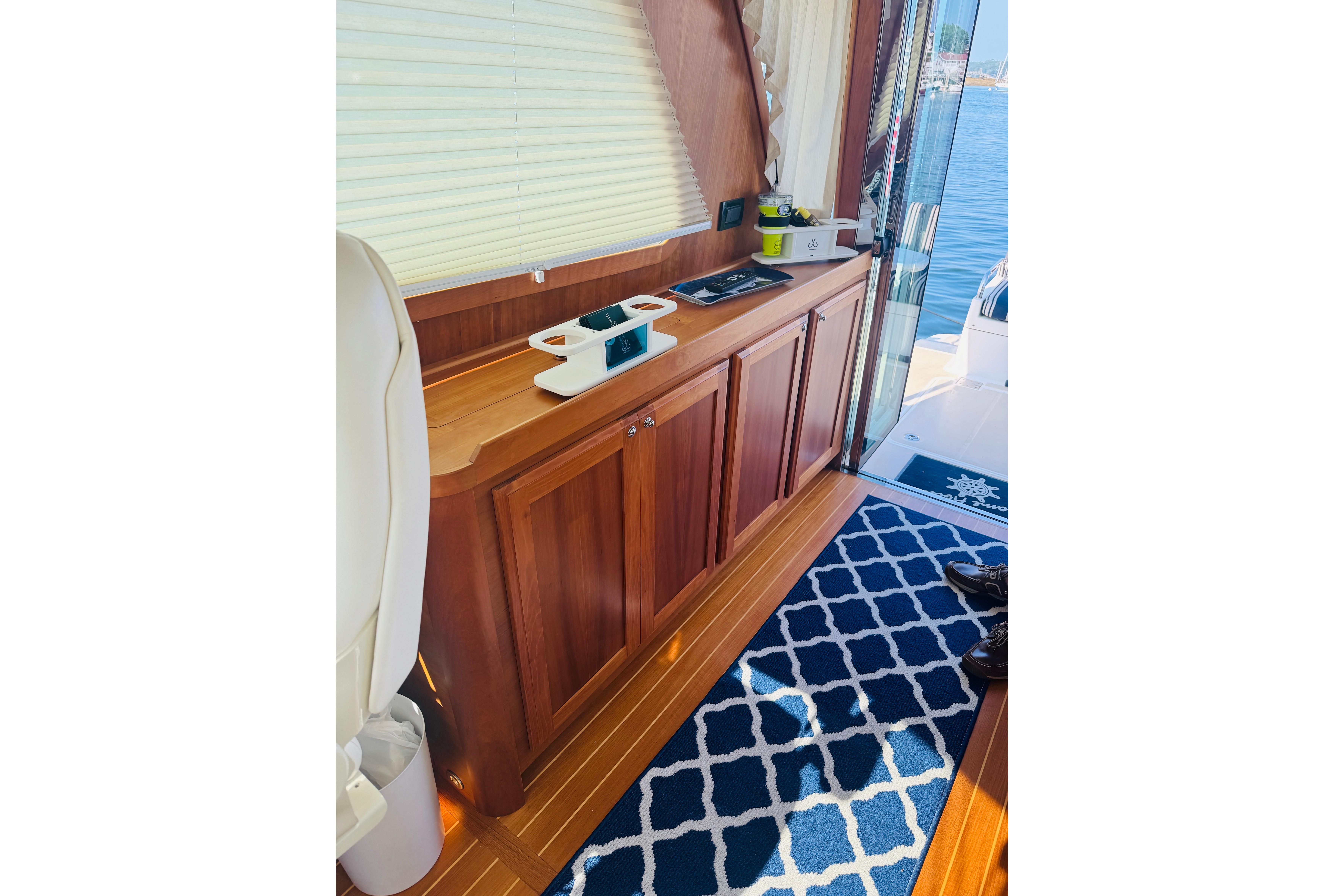 Interior of 2015 Sabre 38 Salon Express with wooden cabinetry and nautical decor.