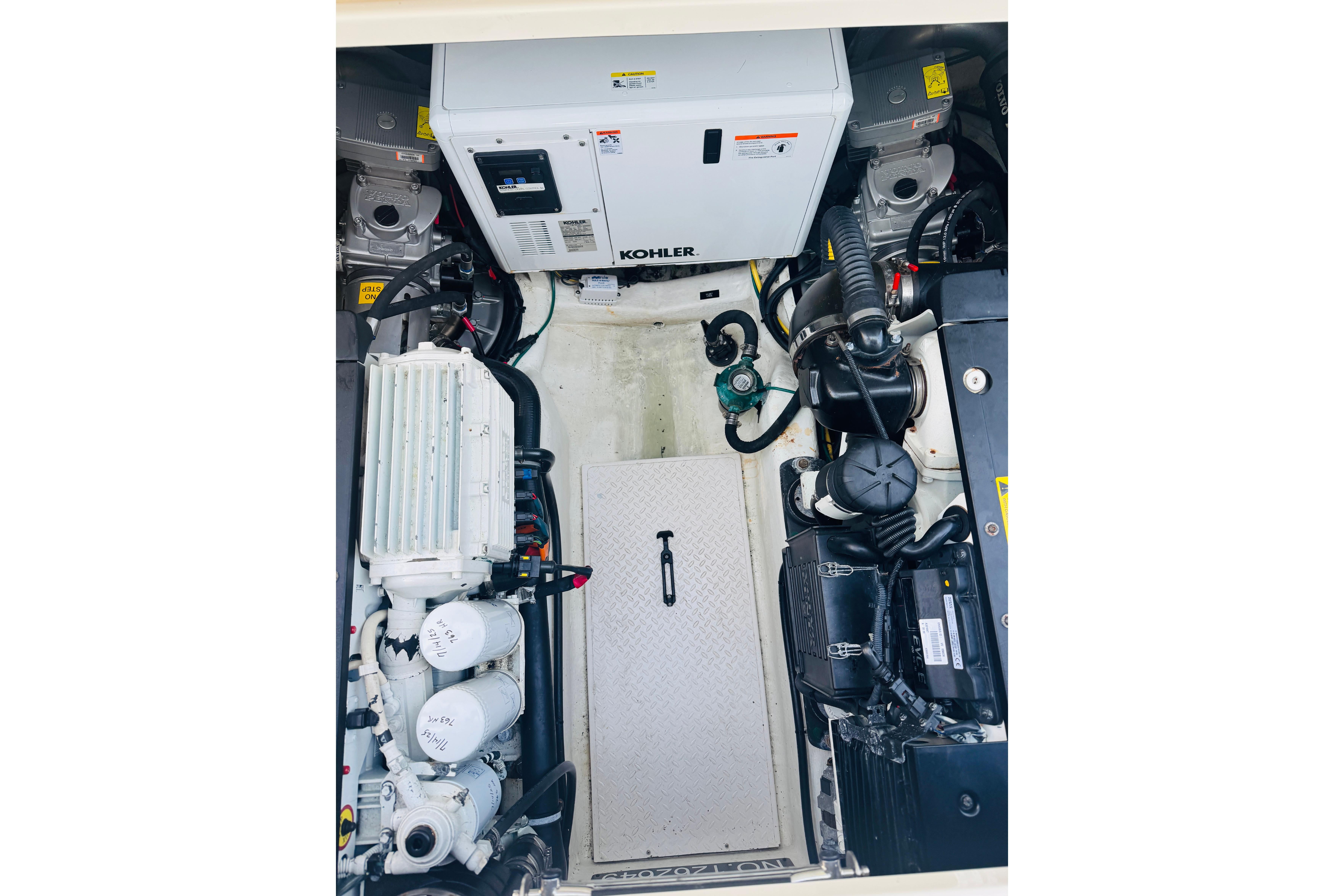 Engine room of 2015 Sabre 38 Salon Express with Kohler generator and mechanical components.