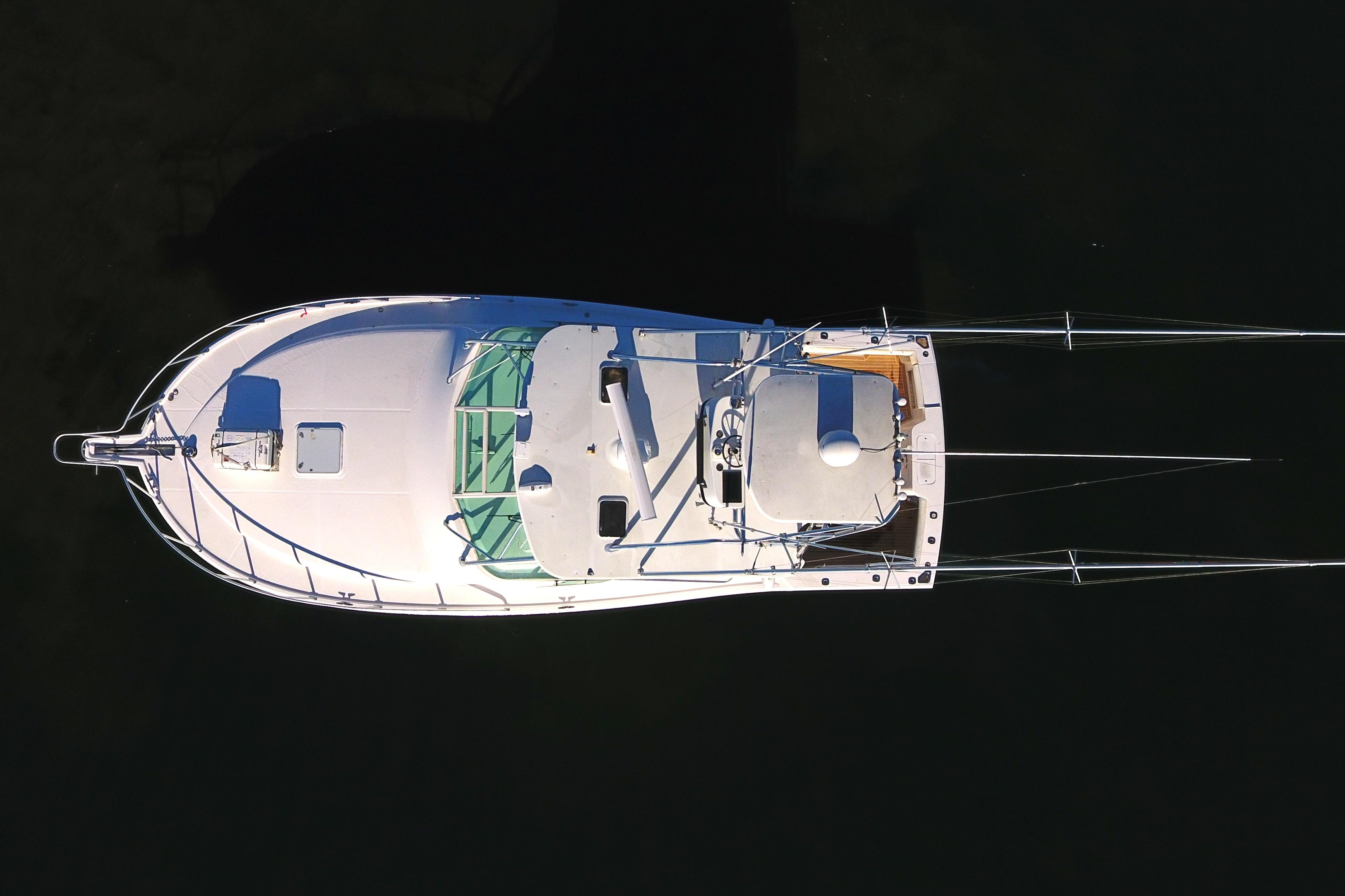 Cabo-Express 2004-TUNA DAZE MA-US-Aerial view of 2004 Cabo Express boat on dark water.-5384122 | Thumbnail