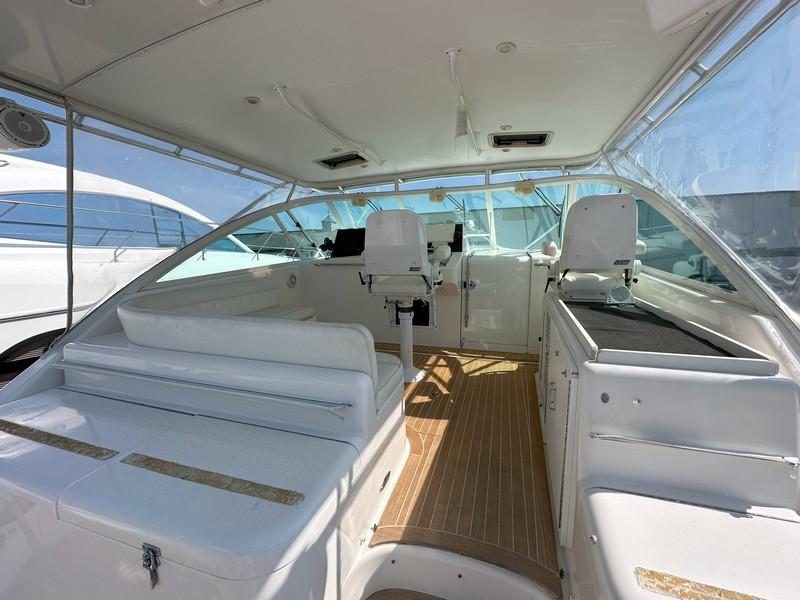 Cabo-Express 2004-TUNA DAZE MA-US-2004 Cabo Express boat interior with white seating and wooden flooring.-5384122 | Thumbnail