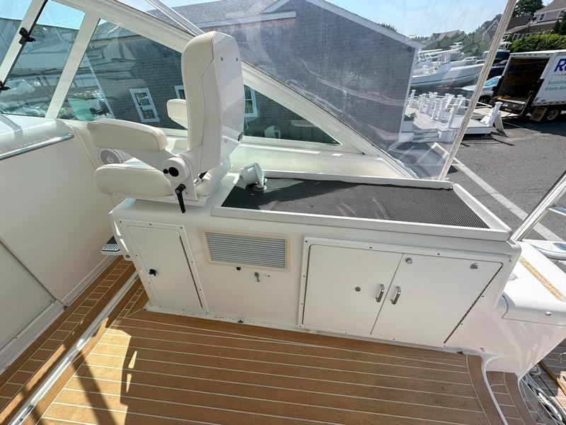 Cabo-Express 2004-TUNA DAZE MA-US-2004 Cabo Express boat interior with captains chair and storage cabinets.-5384122 | Thumbnail