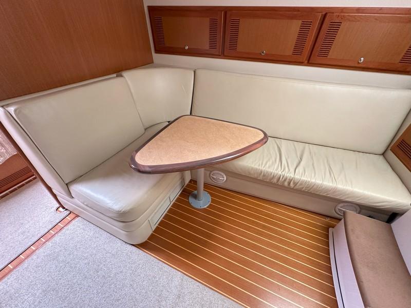 Cabo-Express 2004-TUNA DAZE MA-US-2004 Cabo Express yacht interior with beige seating and wooden accents.-5384122 | Thumbnail