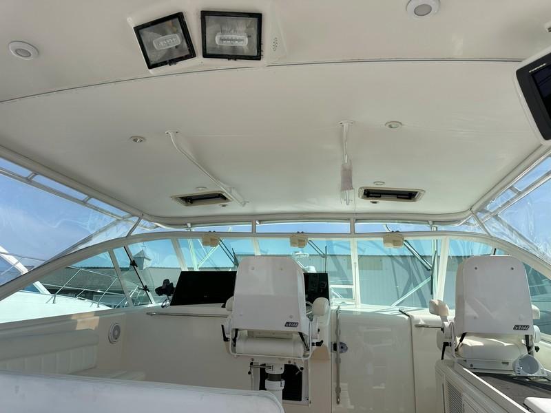 Cabo-Express 2004-TUNA DAZE MA-US-2004 Cabo Express boat interior with helm chairs and navigation equipment.-5384122 | Thumbnail