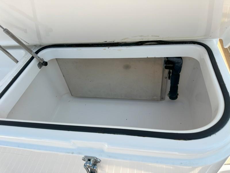 Cabo-Express 2004-TUNA DAZE MA-US-Open storage compartment on a 2004 Cabo Express boat, showing interior details.-5384122 | Thumbnail