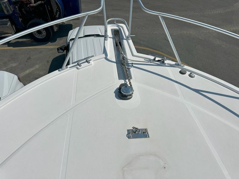 Cabo-Express 2004-TUNA DAZE MA-US-Bow view of a 2004 Cabo Express boat with anchor chain and railing.-5384122 | Thumbnail