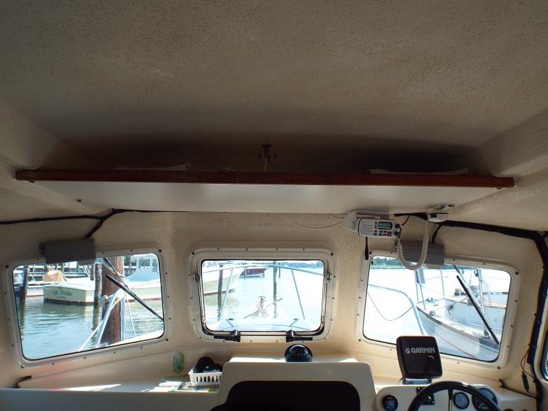 chart rack above helm