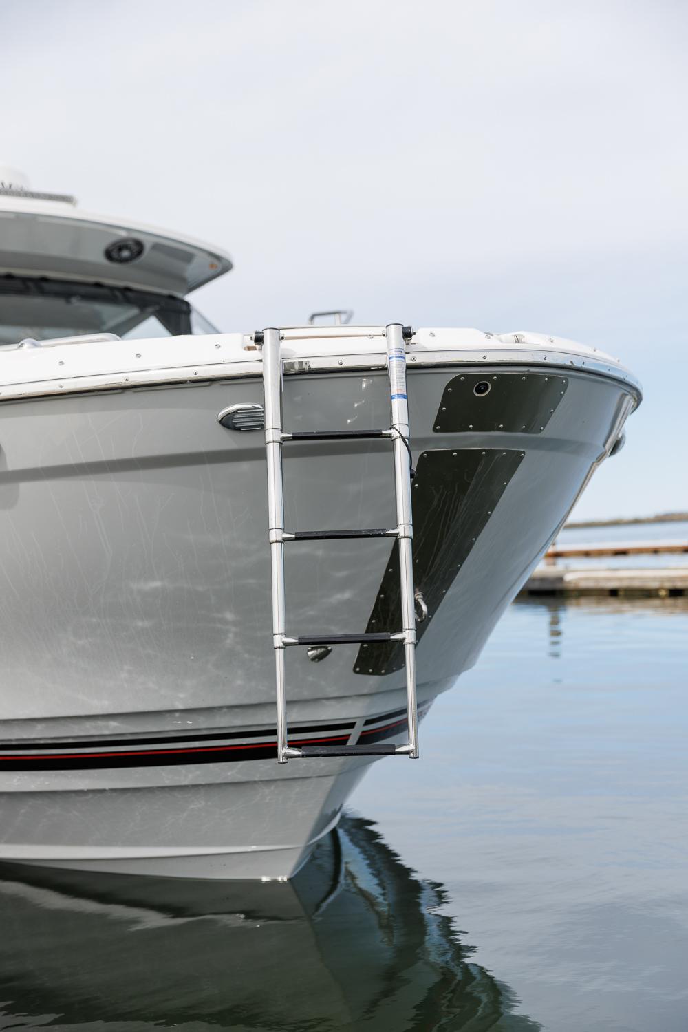 Solara-S-310 CW 2025 -FL-US-Solara S-310 CW 2025 boat bow with ladder on calm water.-9624144 | Thumbnail