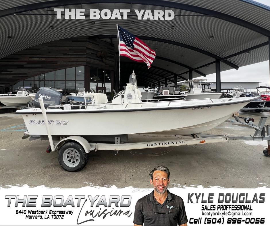 Blazer 1860 boat at The Boat Yard, Marrero, Louisiana, with American flag and sales contact details.
