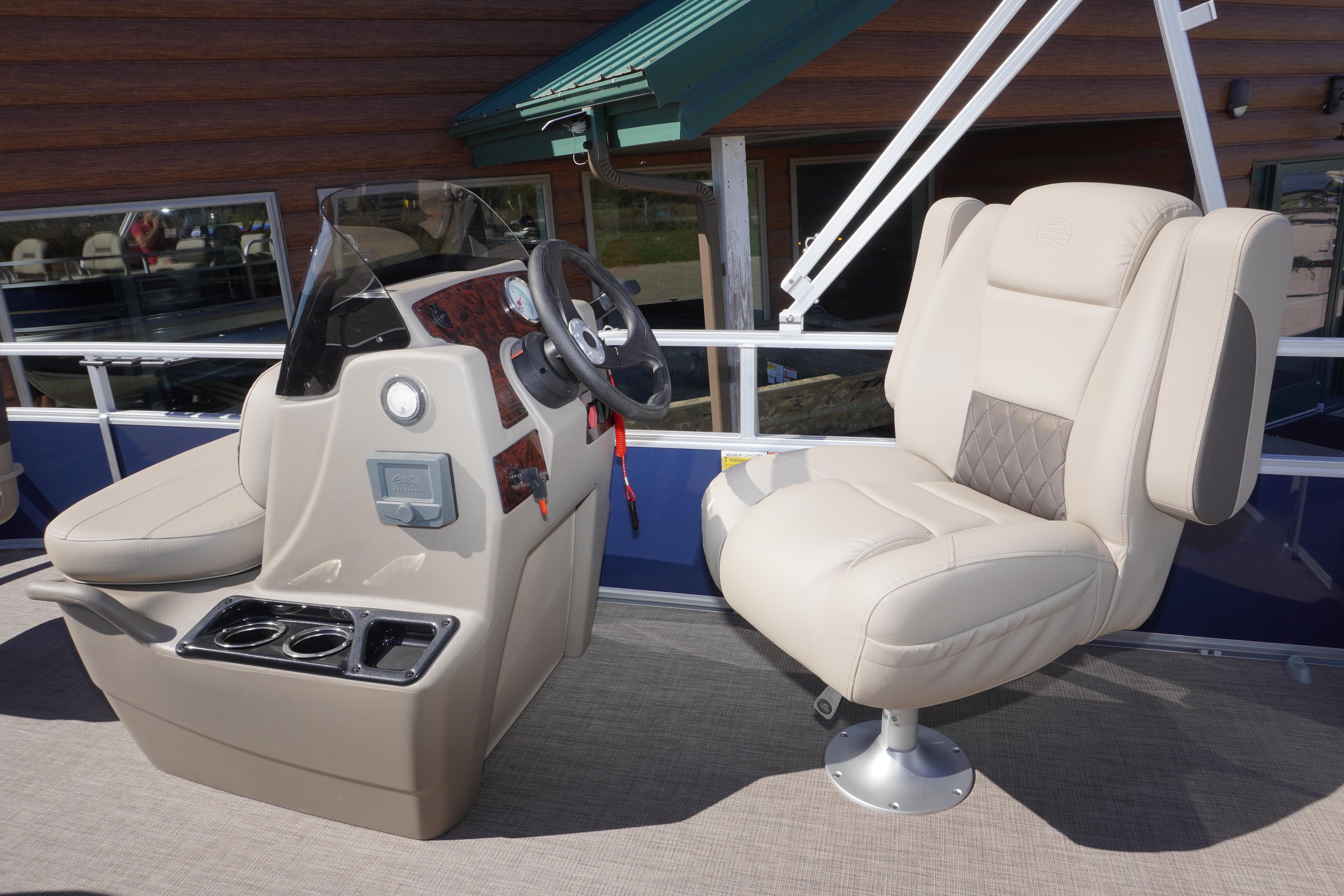 2025 Sun Tracker Bass Buggy 16 XL Select boat interior with steering console and plush seating.