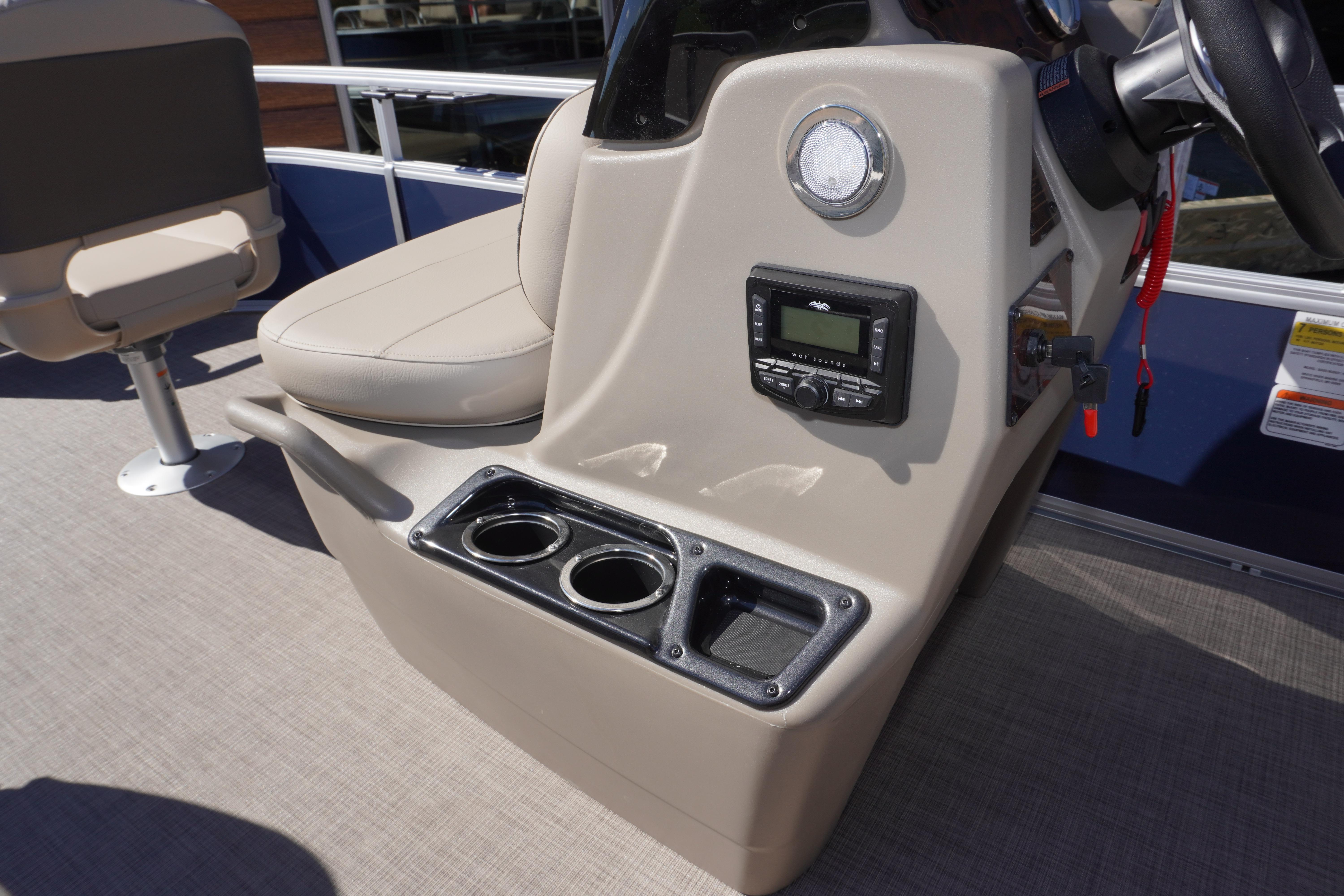 2025 Sun Tracker Bass Buggy 16 XL Select console with cup holders and control panel.