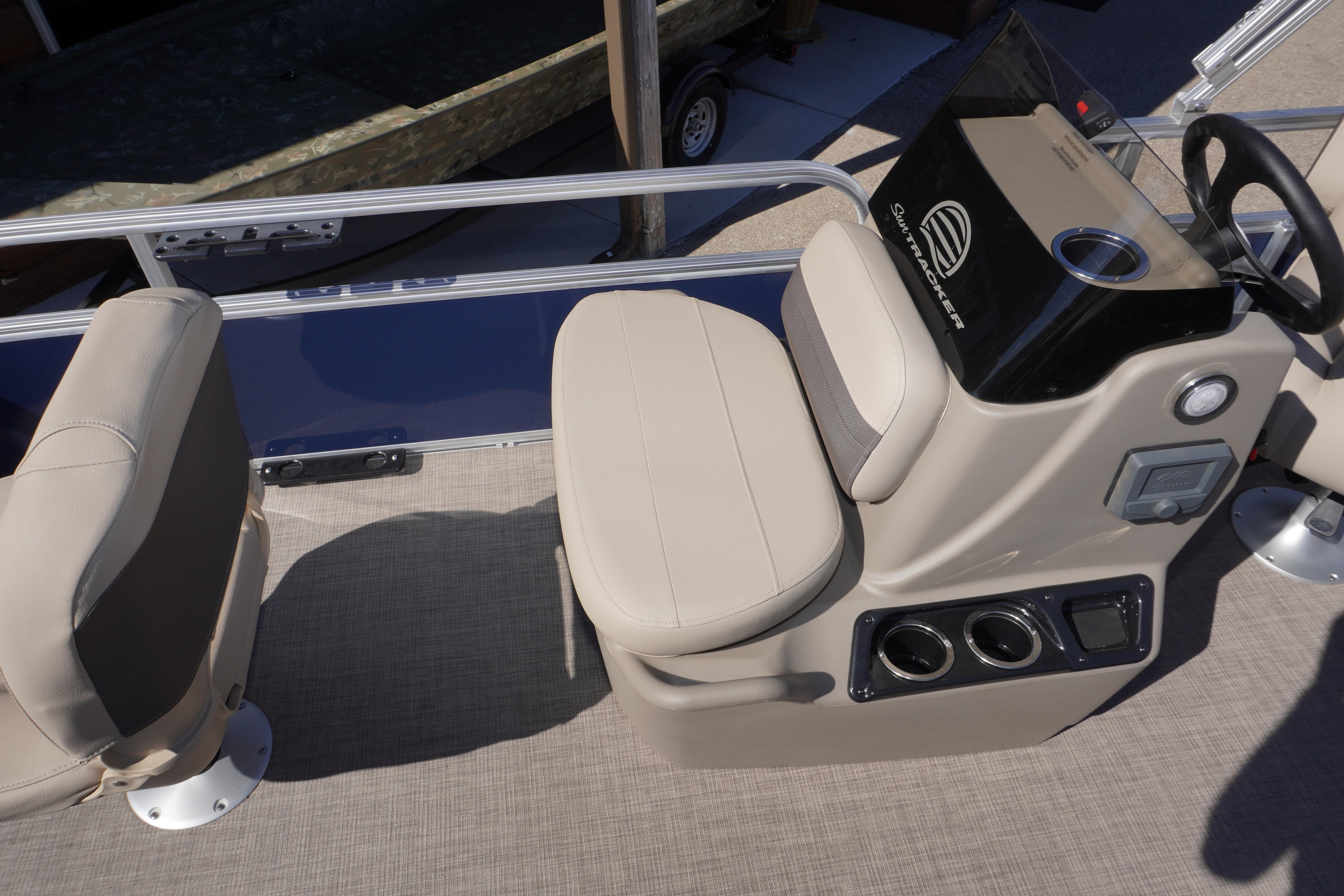 2025 Sun Tracker Bass Buggy 16 XL Select boat interior with beige seating and console.
