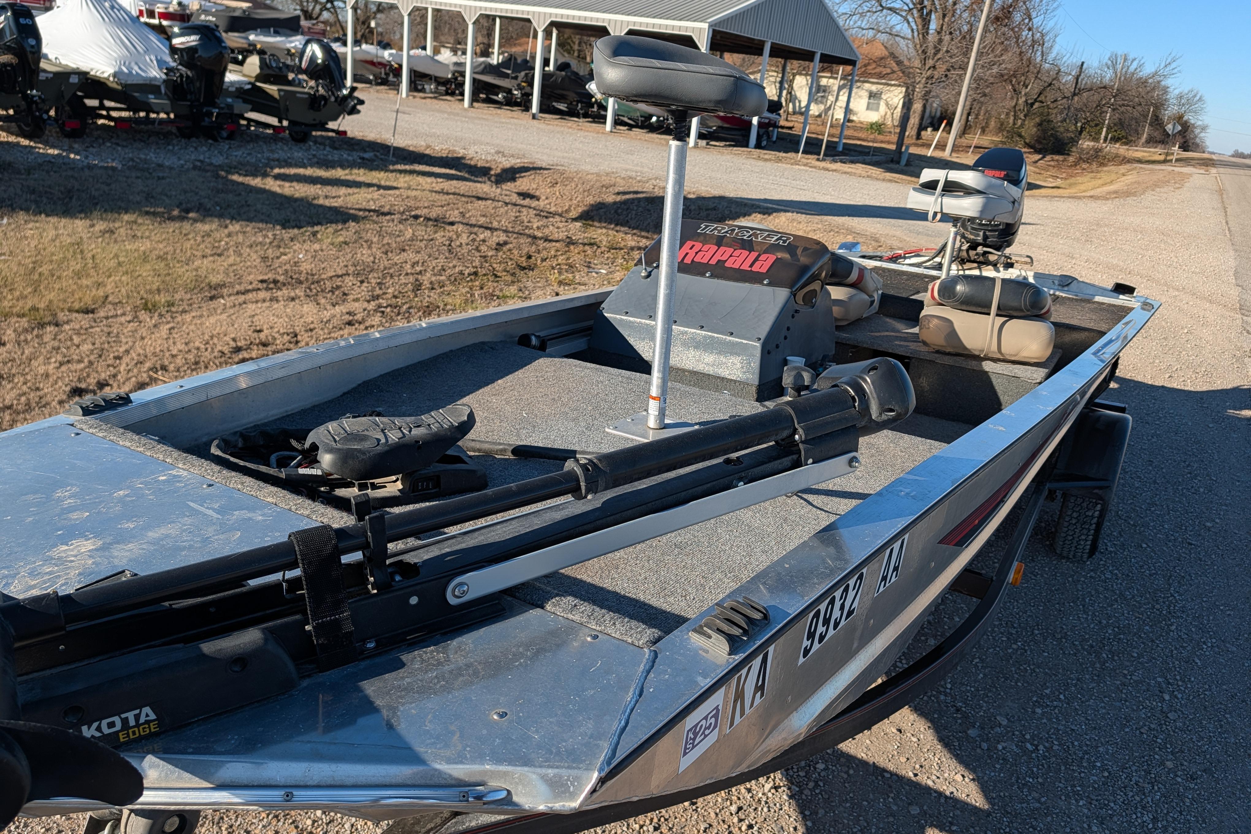 1988 Bass Tracker Pro 17 fishing boat with trolling motor and seating.