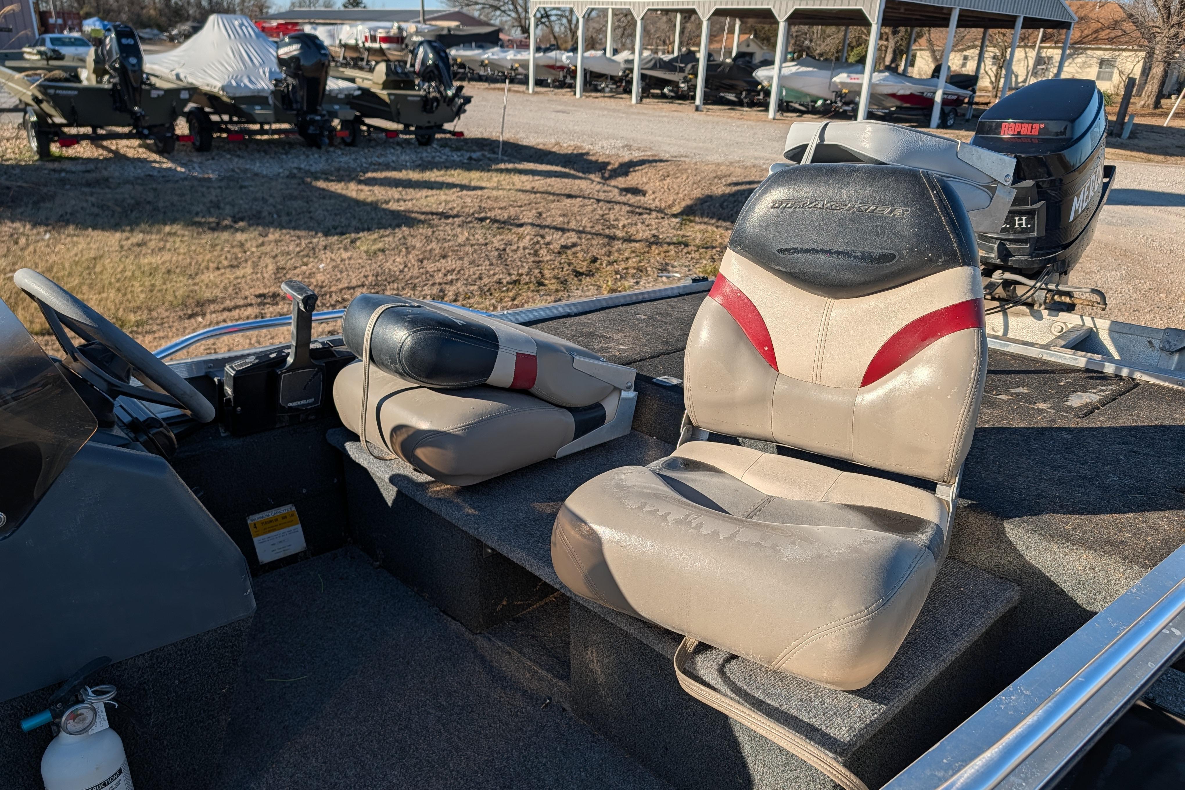 1988 Bass Tracker Pro 17 boat interior with seats and steering wheel.