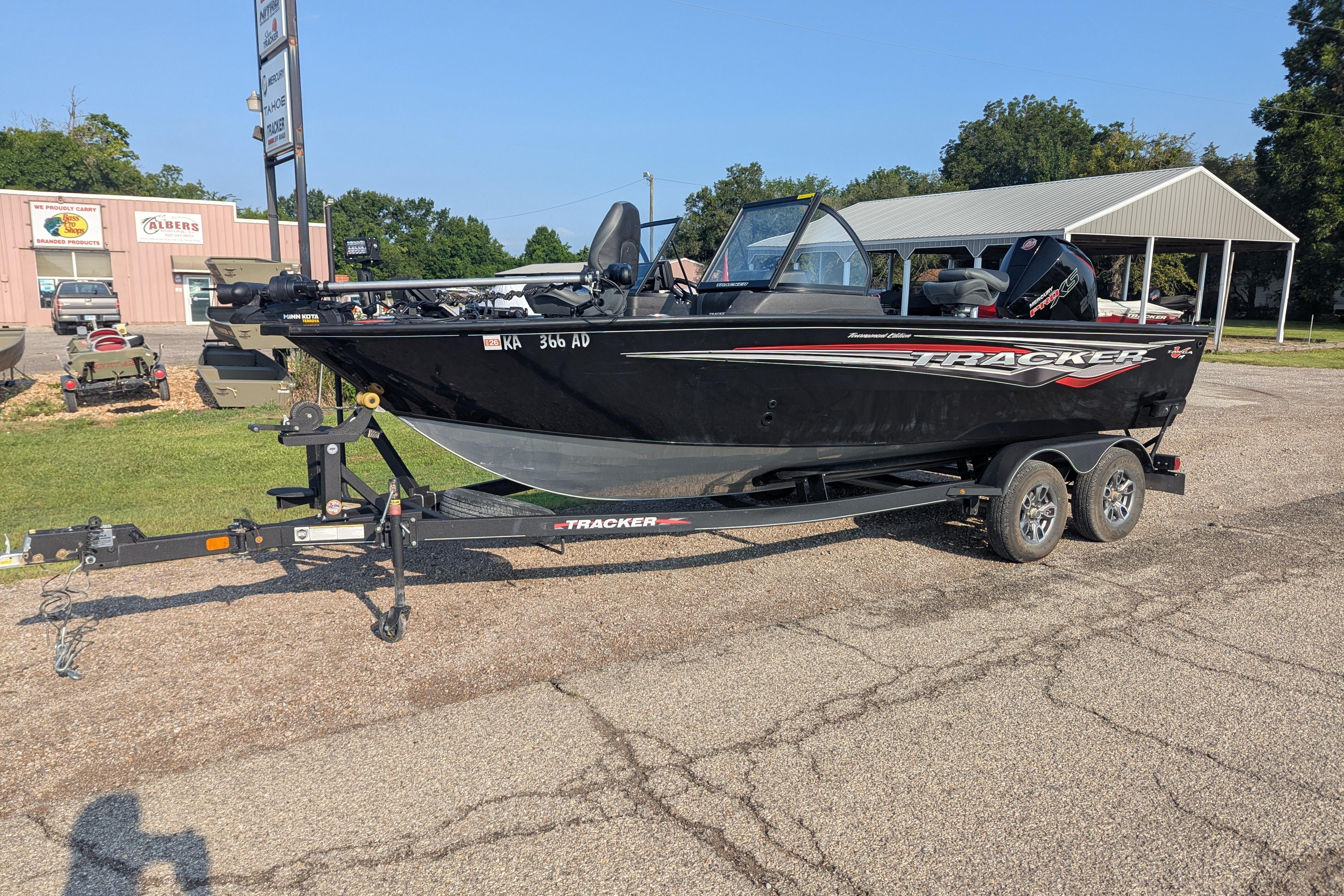2023 Tracker Targa V-19 Combo Tournament Edition boat on trailer, parked outdoors.