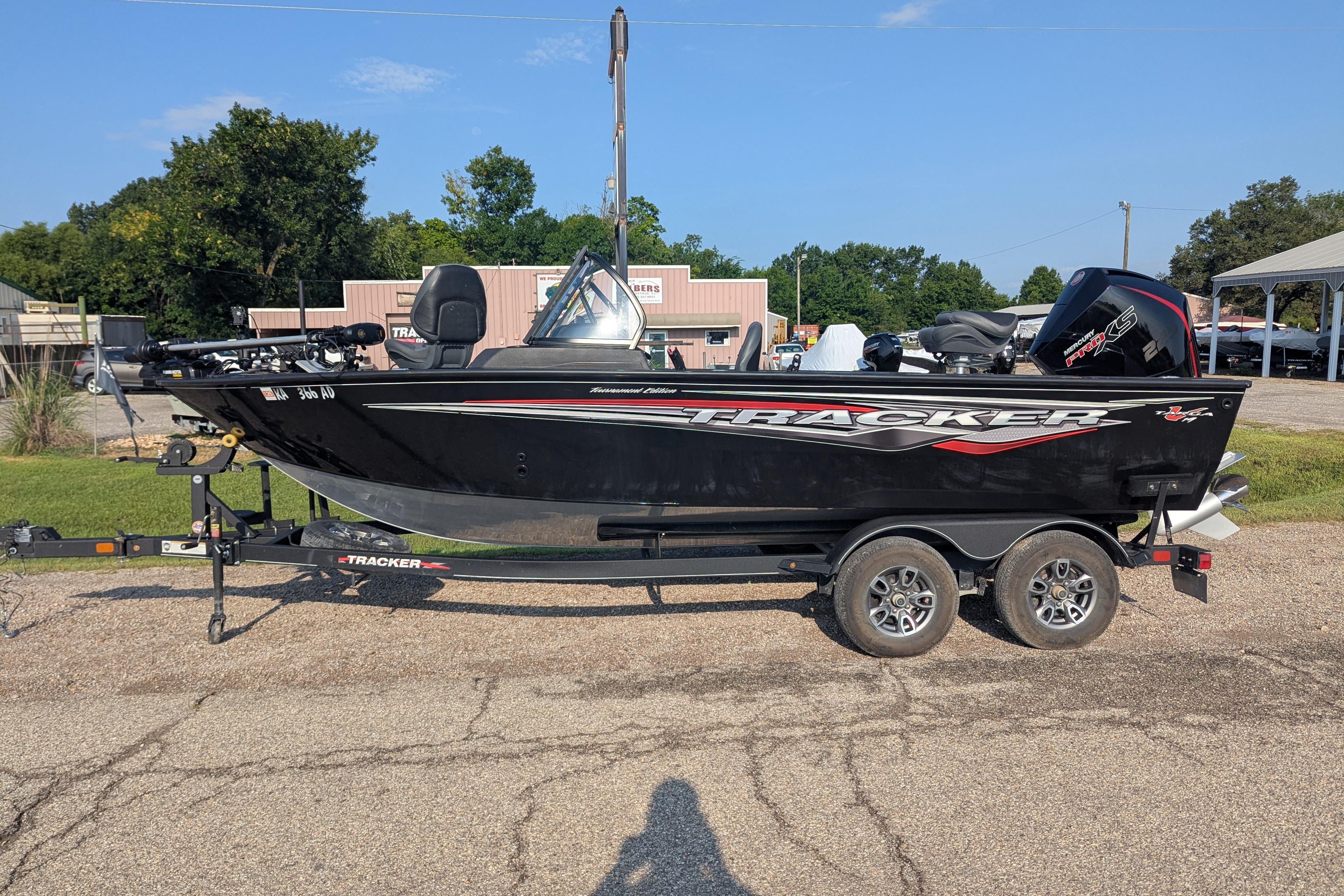 2023 Tracker Targa V-19 Combo Tournament Edition boat on trailer, parked outdoors.