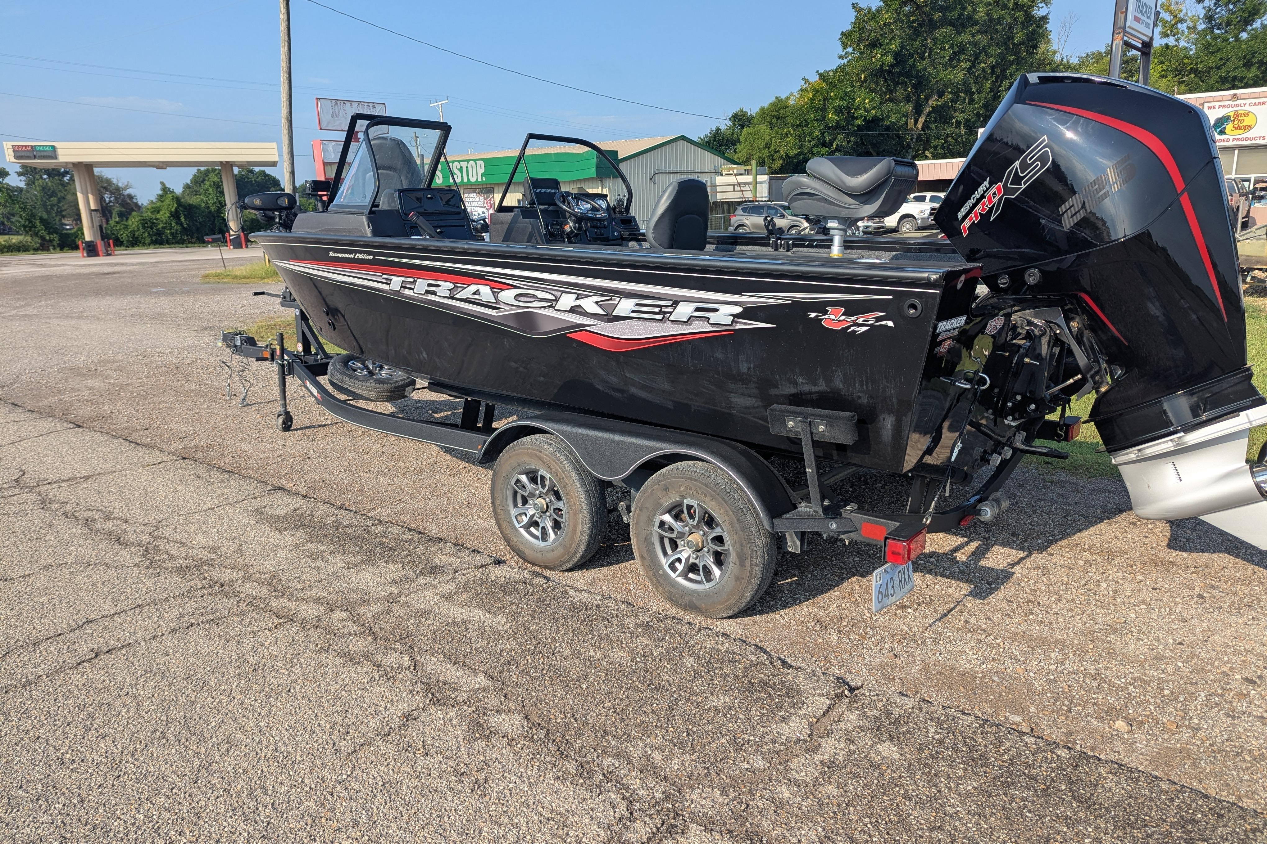 2023 Tracker Targa V-19 Combo Tournament Edition boat on trailer in parking lot.