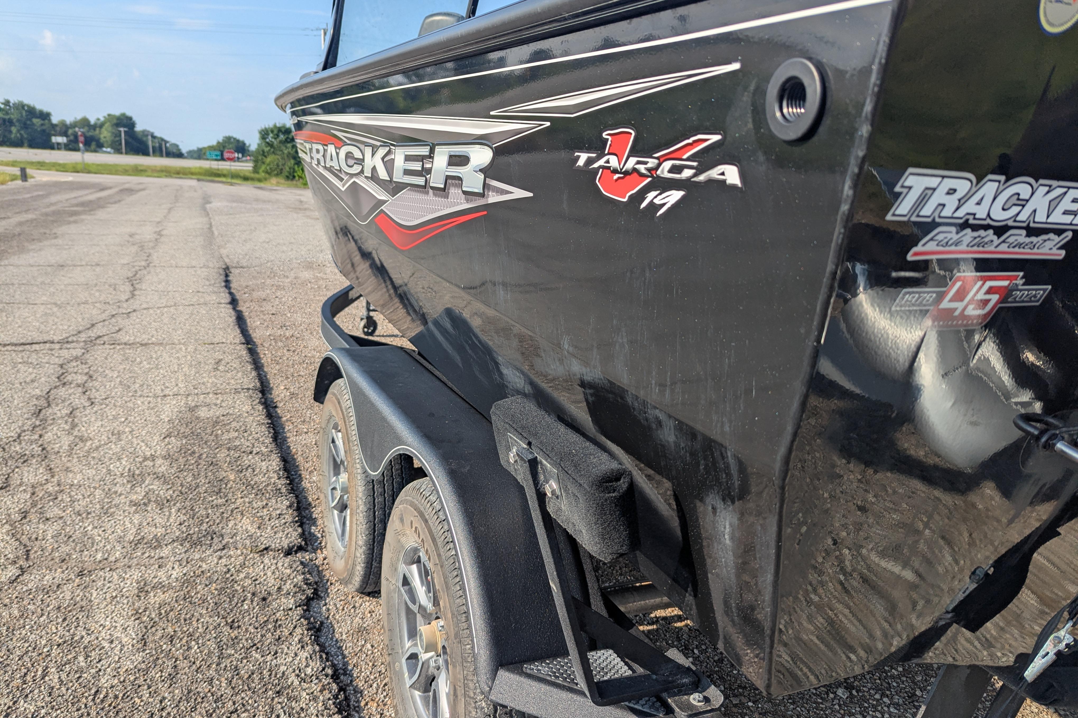 2023 Tracker Targa V-19 Combo Tournament Edition boat on trailer, side view.