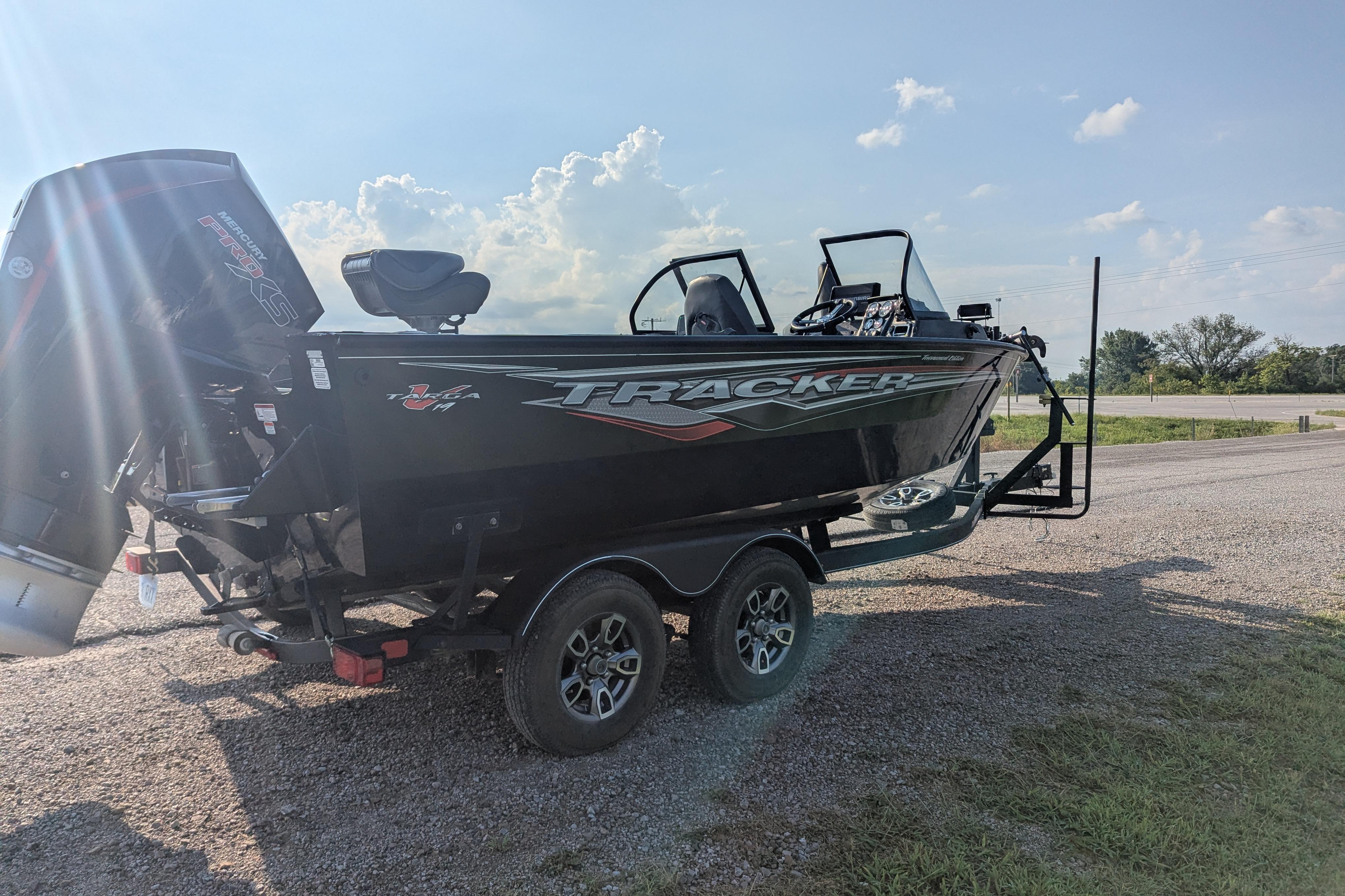 2023 Tracker Targa V-19 Combo Tournament Edition boat on trailer, sunny day.