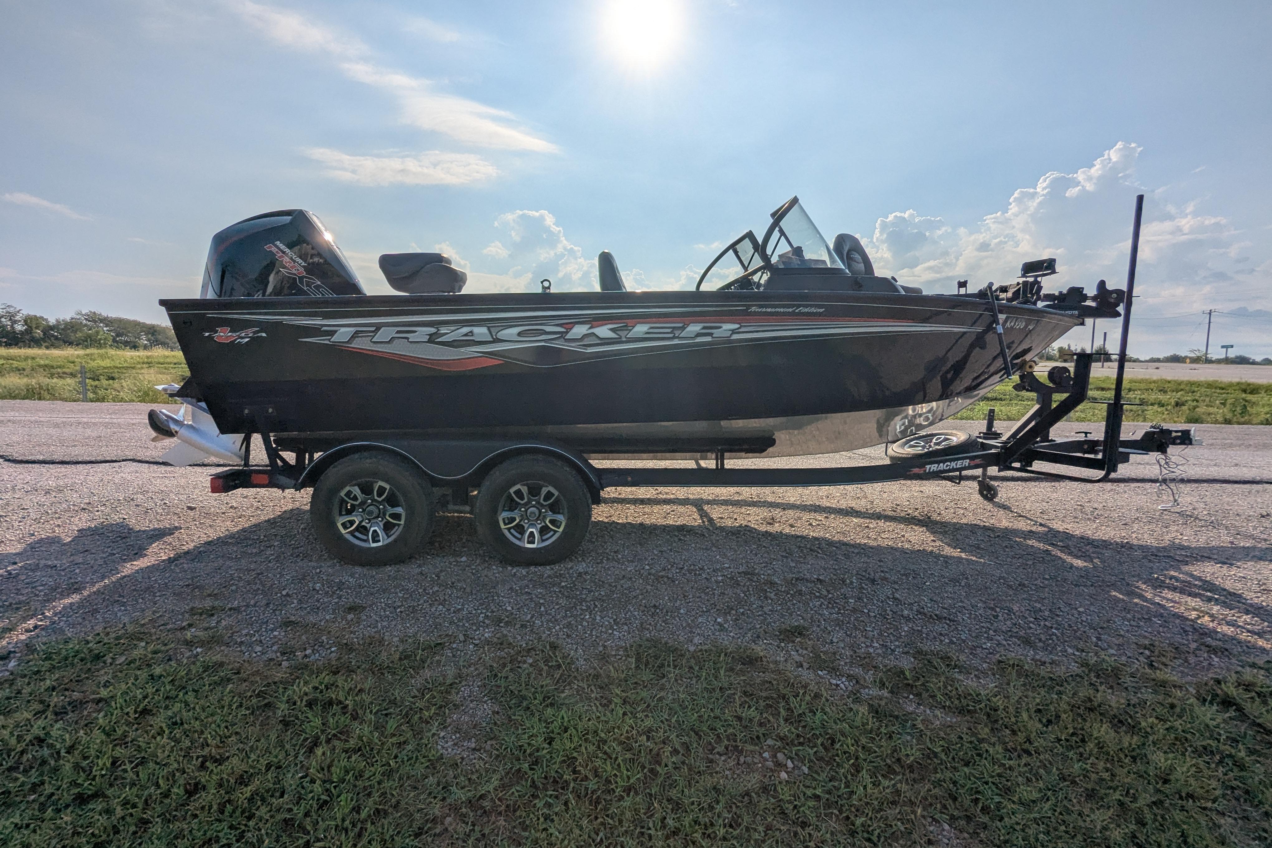 2023 Tracker Targa V-19 Combo Tournament Edition boat on trailer, parked outdoors.
