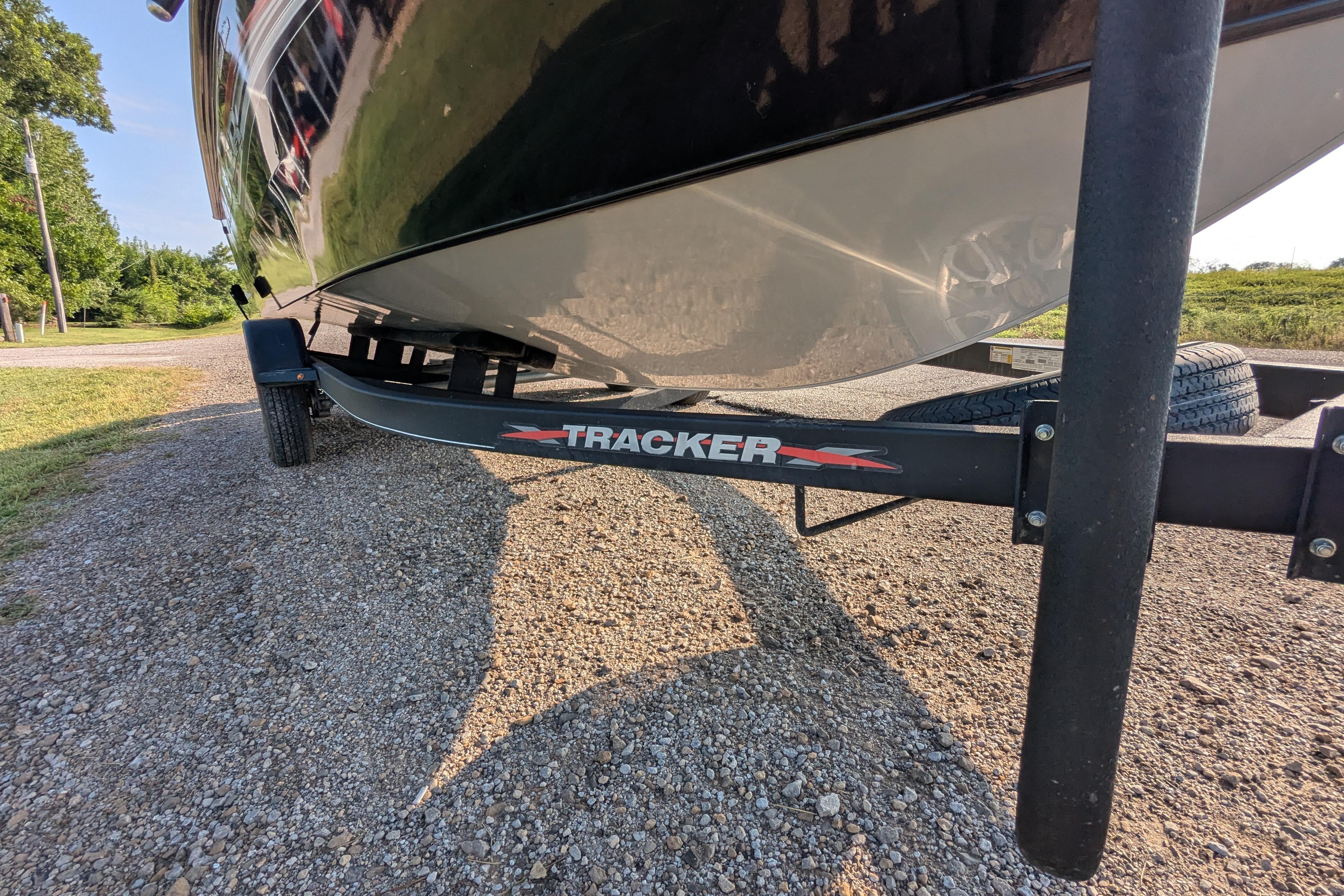 2023 Tracker Targa V-19 Combo Tournament Edition boat on trailer, parked on gravel.