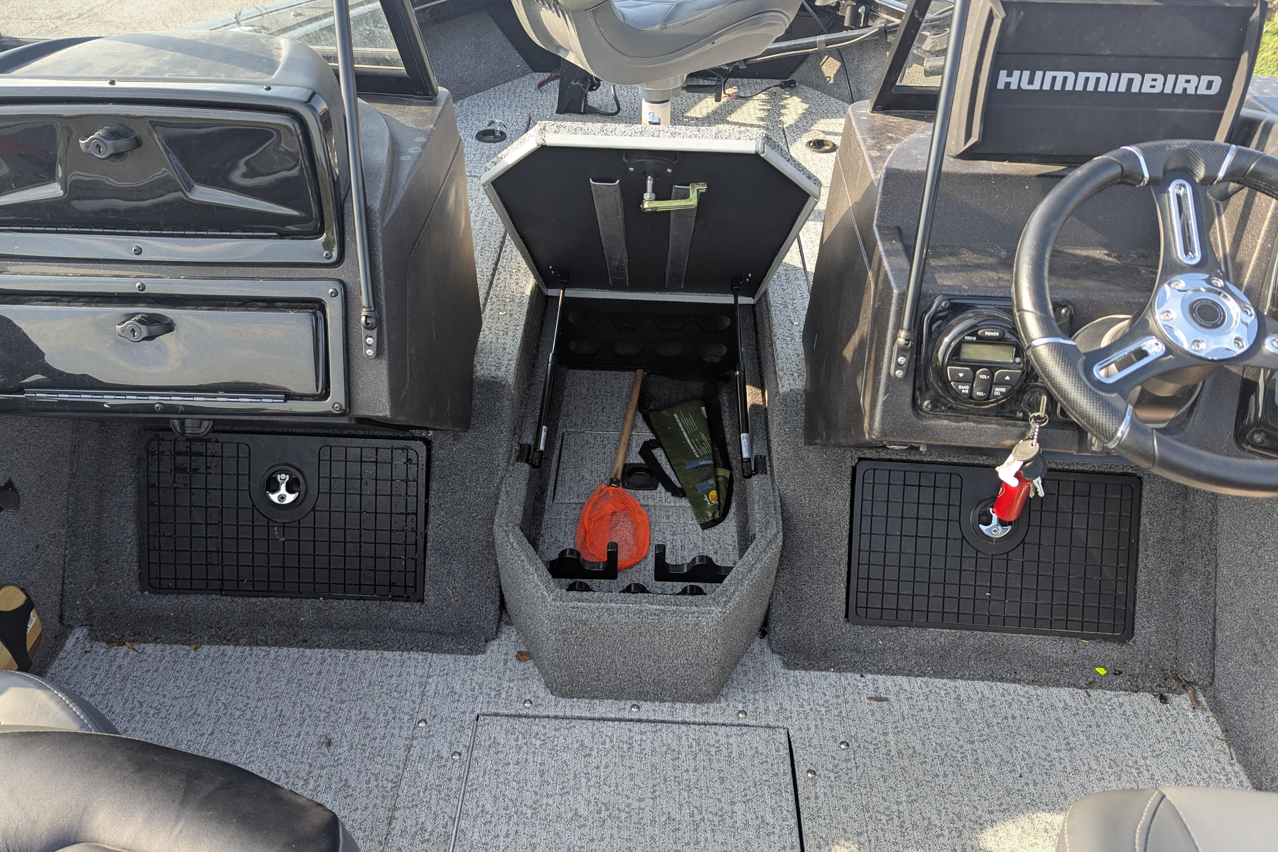 2023 Tracker Targa V-19 Combo Tournament Edition boat interior with steering wheel and storage compartments.
