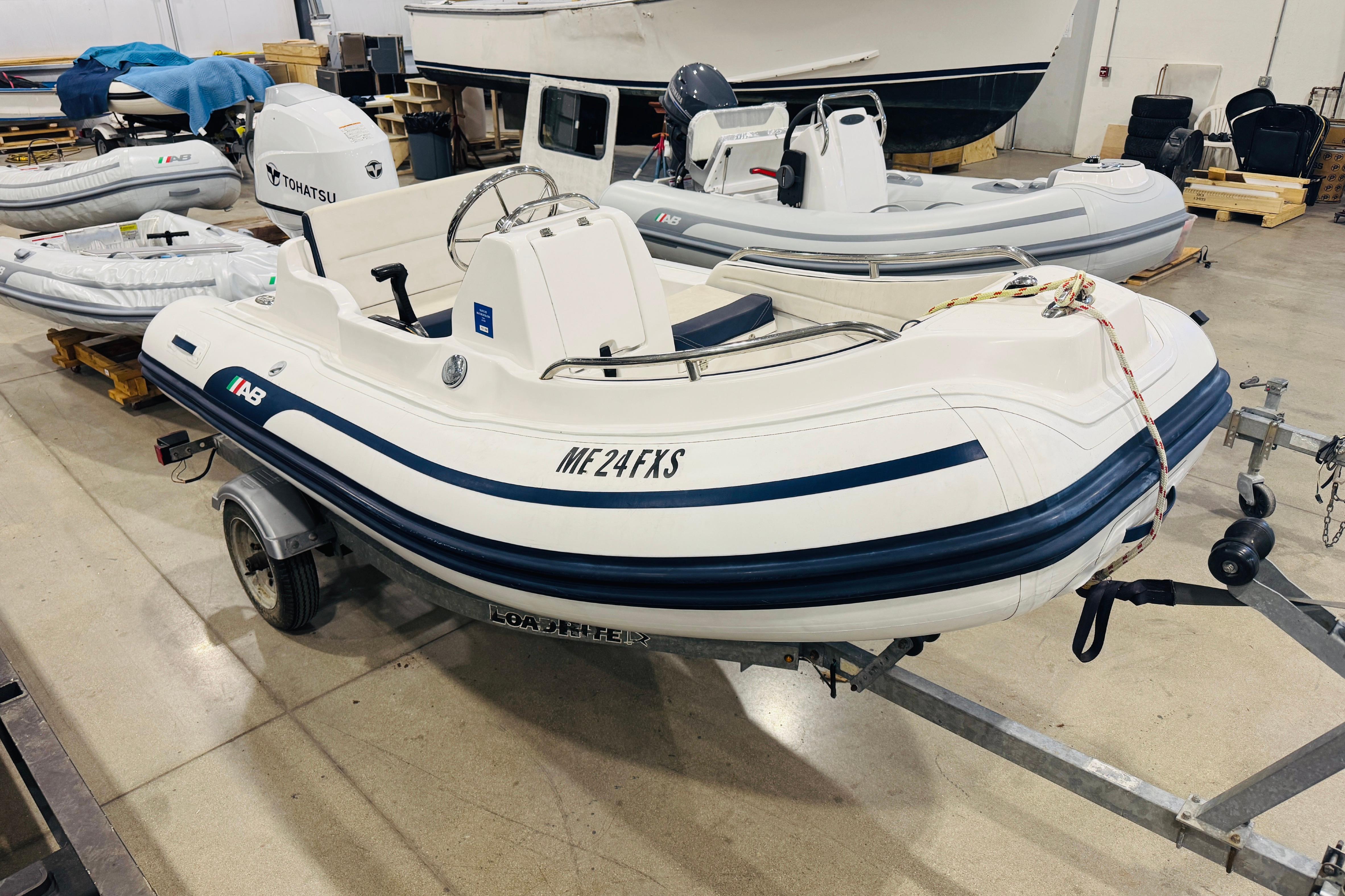 2019 AB Inflatables Nautilus 11 DLX boat on trailer in indoor storage.