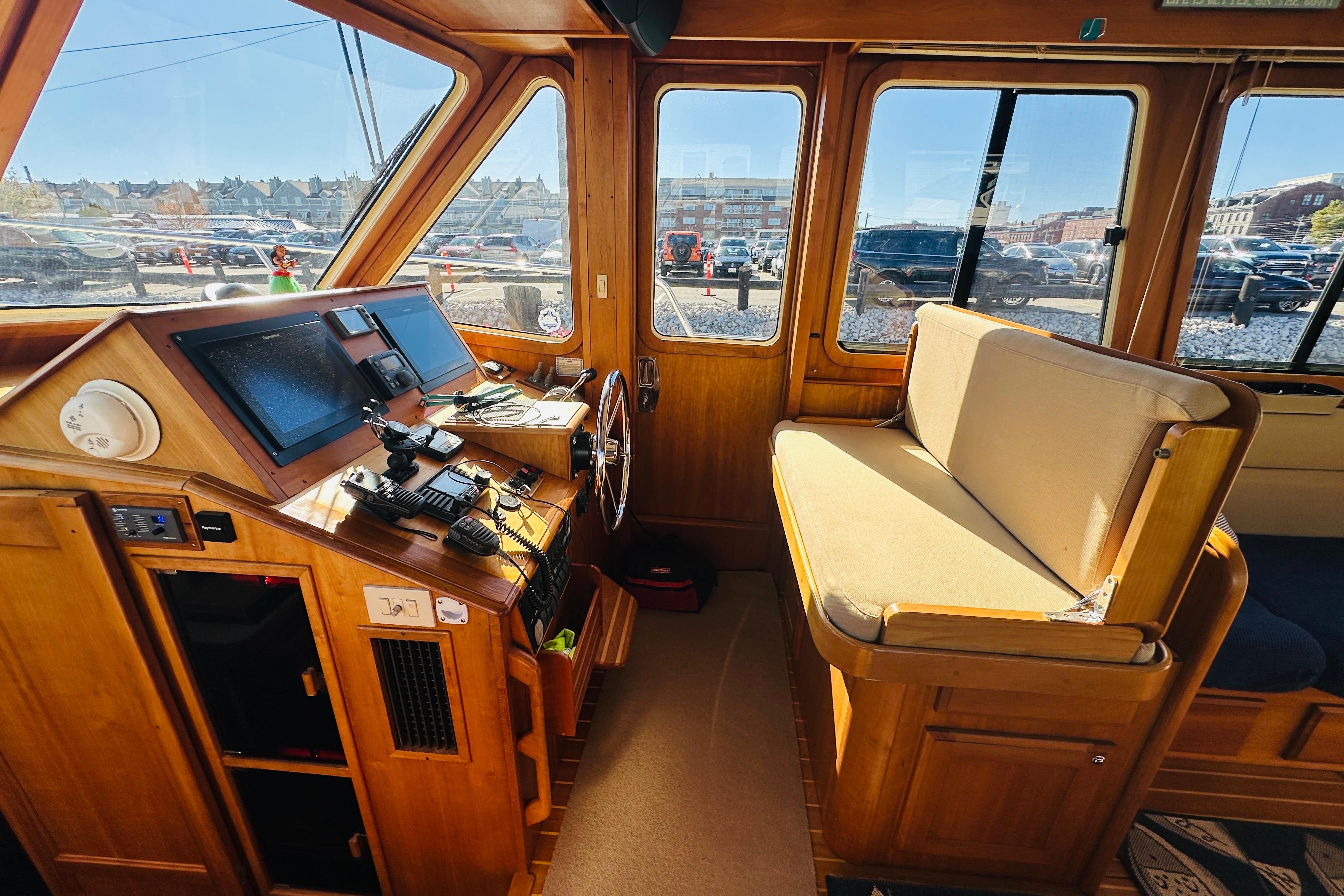 2006 Sabre 42 Fly Bridge interior with navigation controls and seating area.