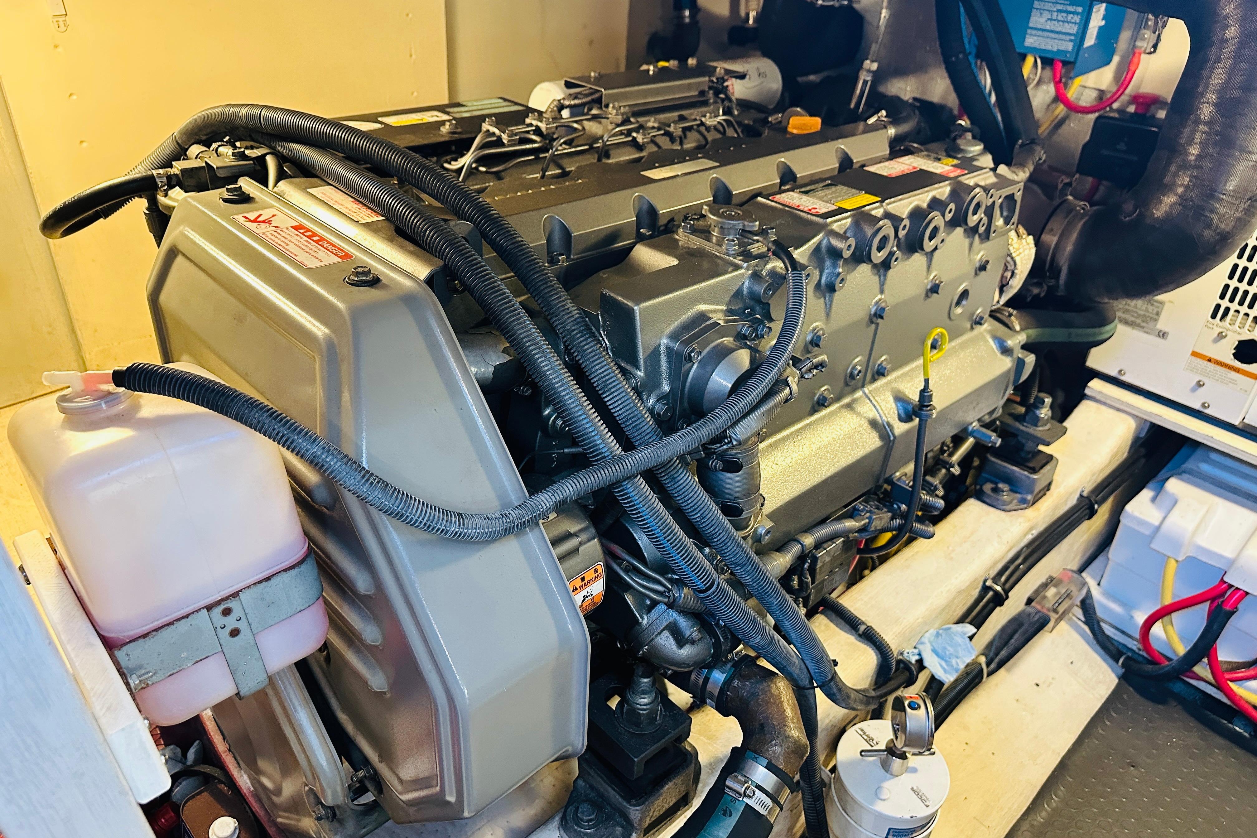 Engine room of 2006 Sabre 42 Fly Bridge yacht, showcasing detailed machinery components.