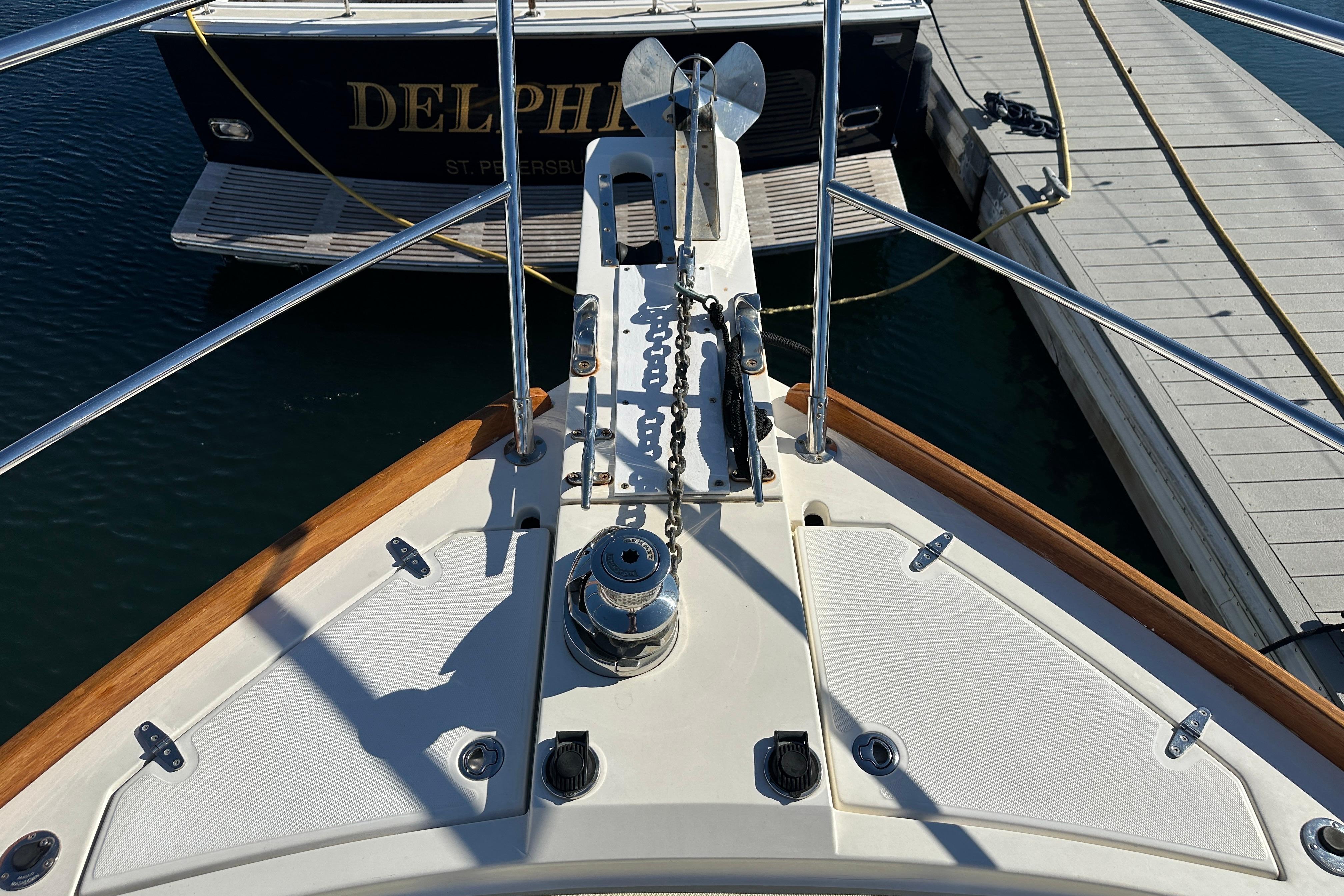 Bow view of 2006 Sabre 42 Fly Bridge yacht docked at marina.