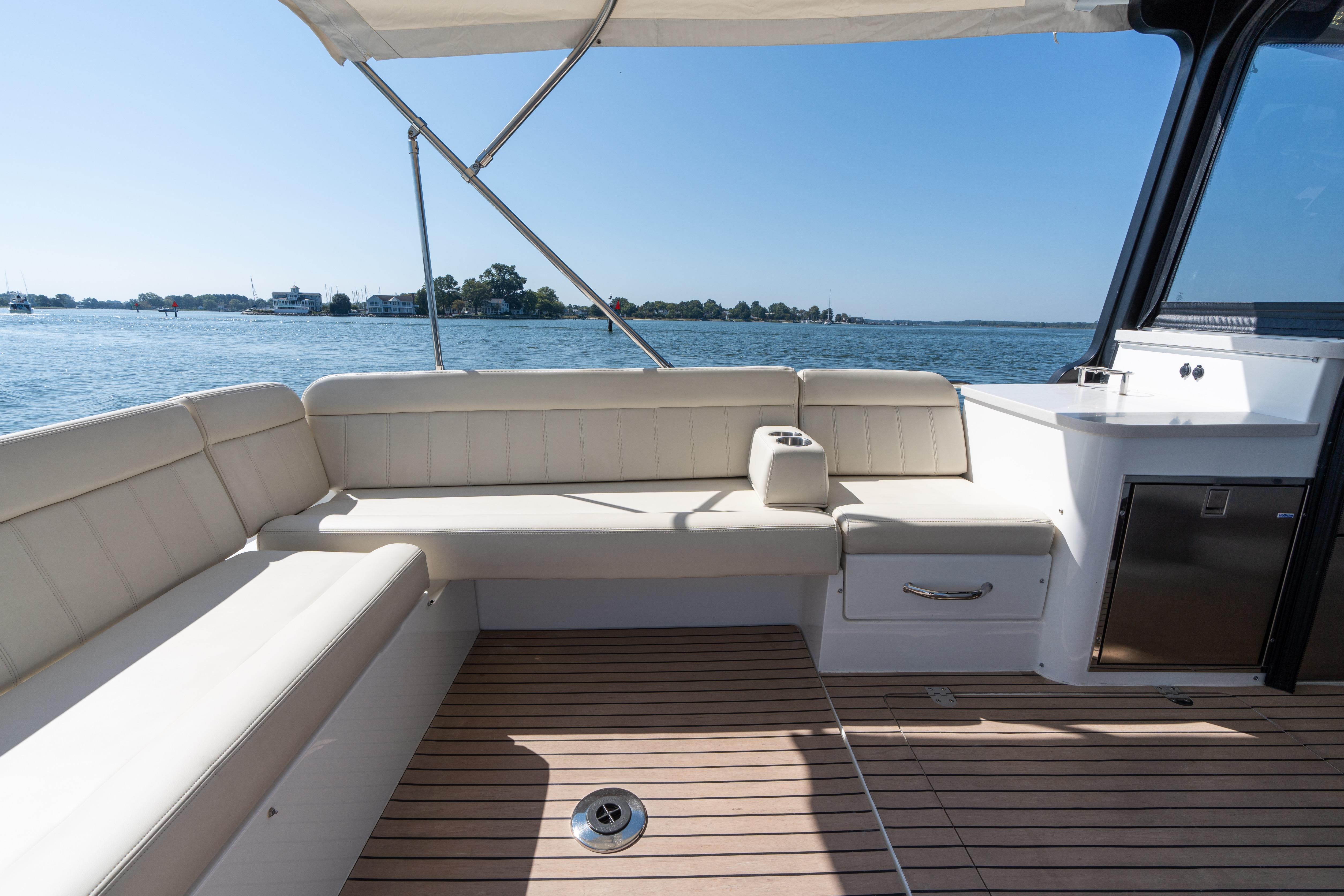 2023 MJM Yachts 4 interior with elegant seating and scenic water view.