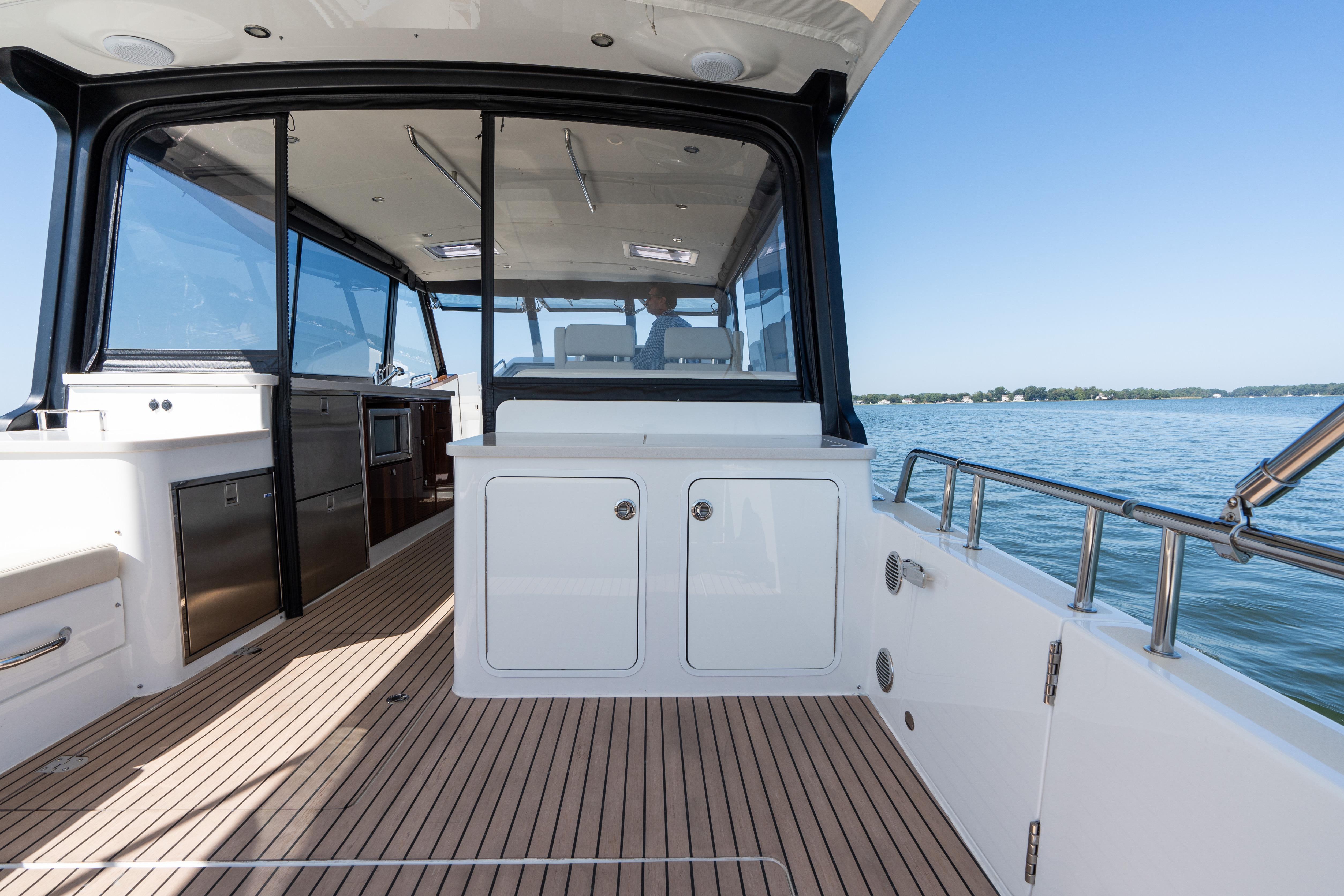 2023 MJM Yachts 4 interior with sleek design and spacious deck on calm waters.