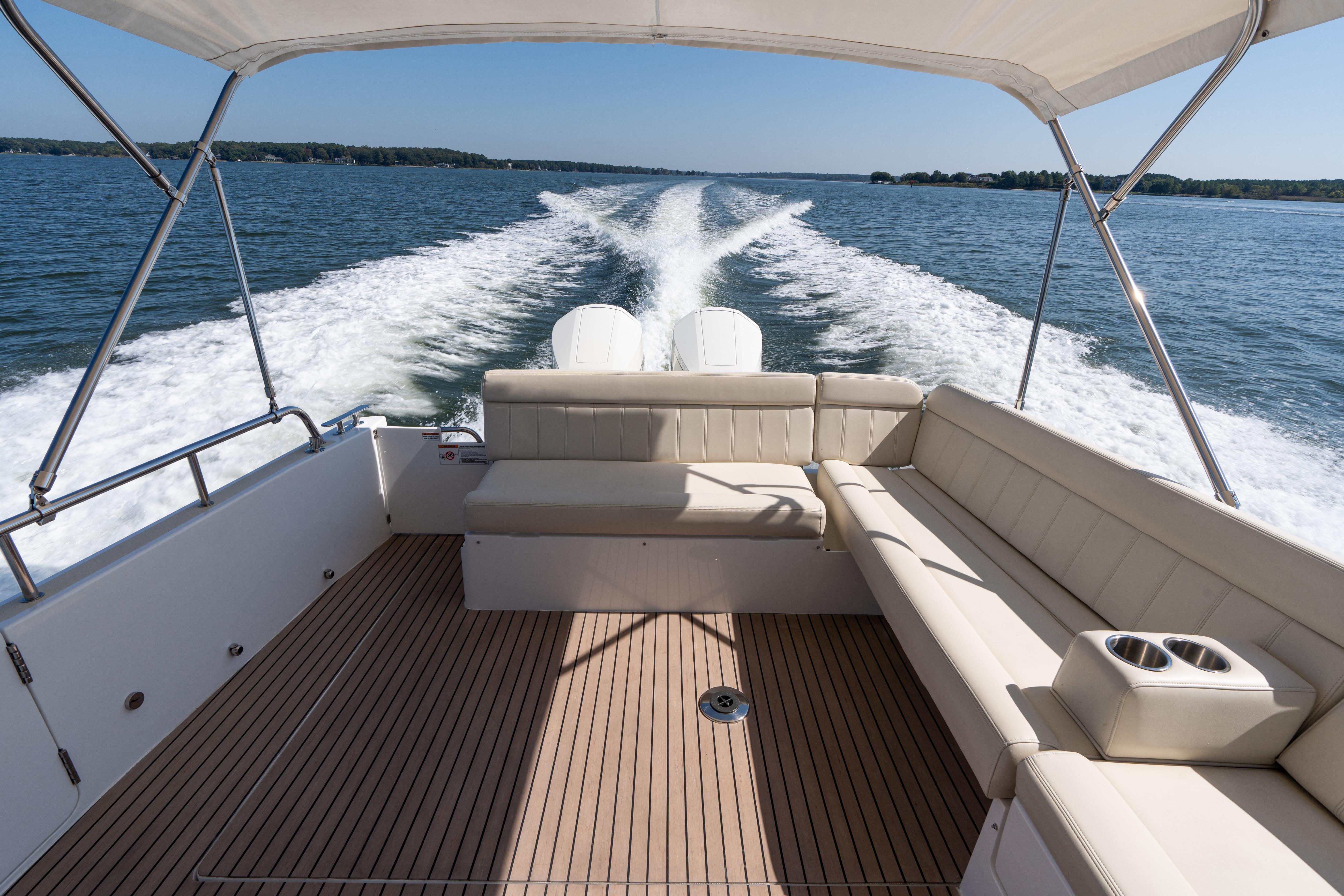 2023 MJM Yachts 4 cruising on open water, featuring spacious seating and elegant design.