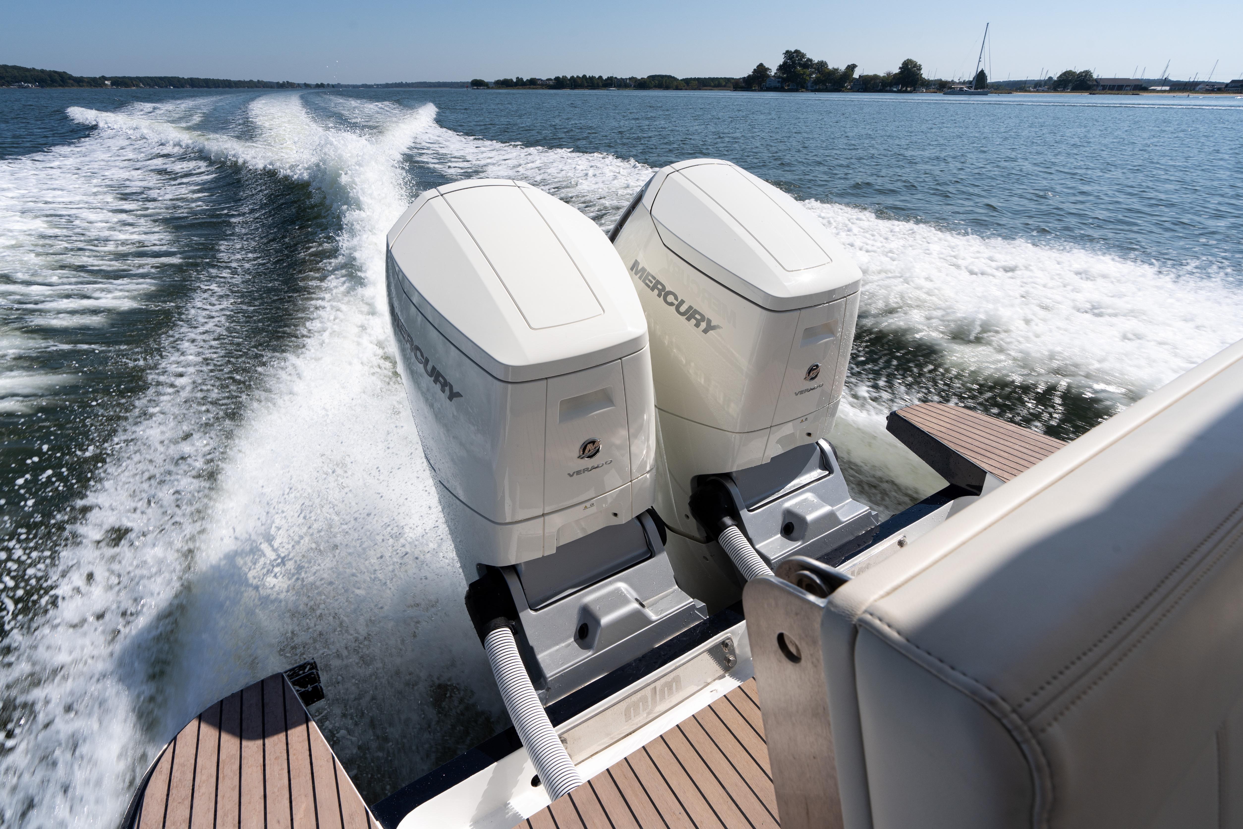 2023 MJM Yachts 4 with dual Mercury outboard engines cruising on open water.