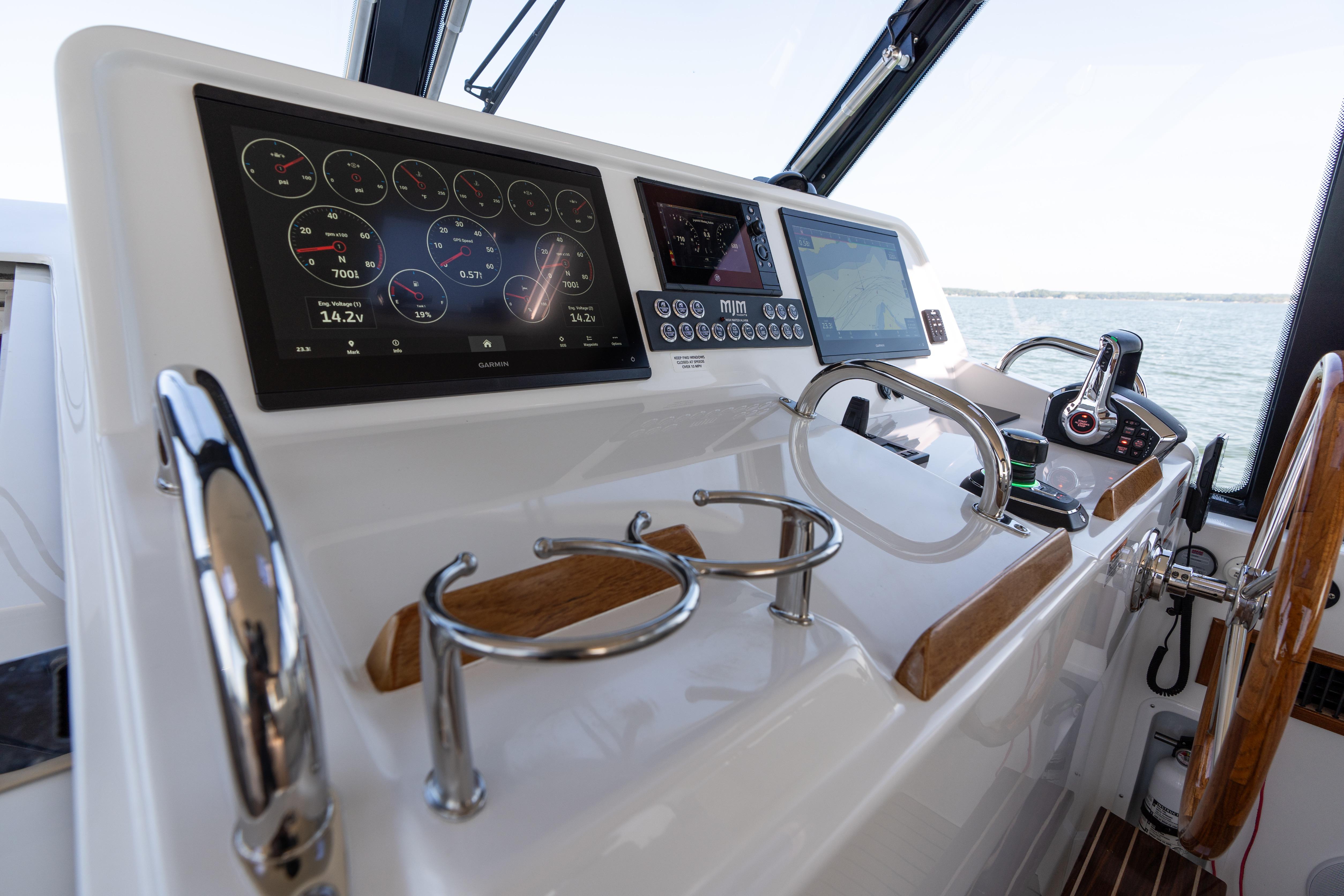 Helm of 2023 MJM Yachts 4 with advanced navigation displays and controls.