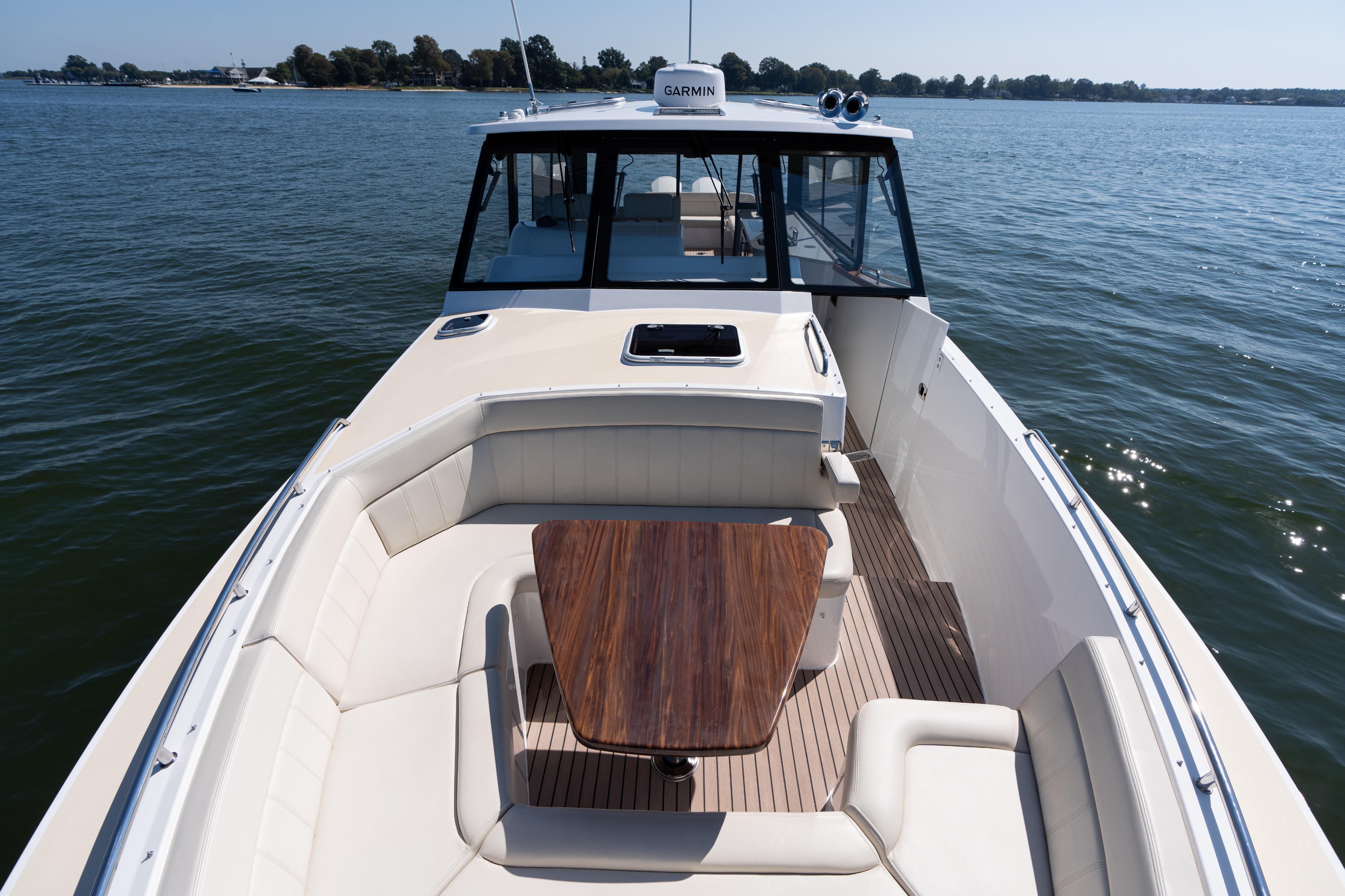 2023 MJM Yachts 4 model on water, featuring spacious deck and seating area.
