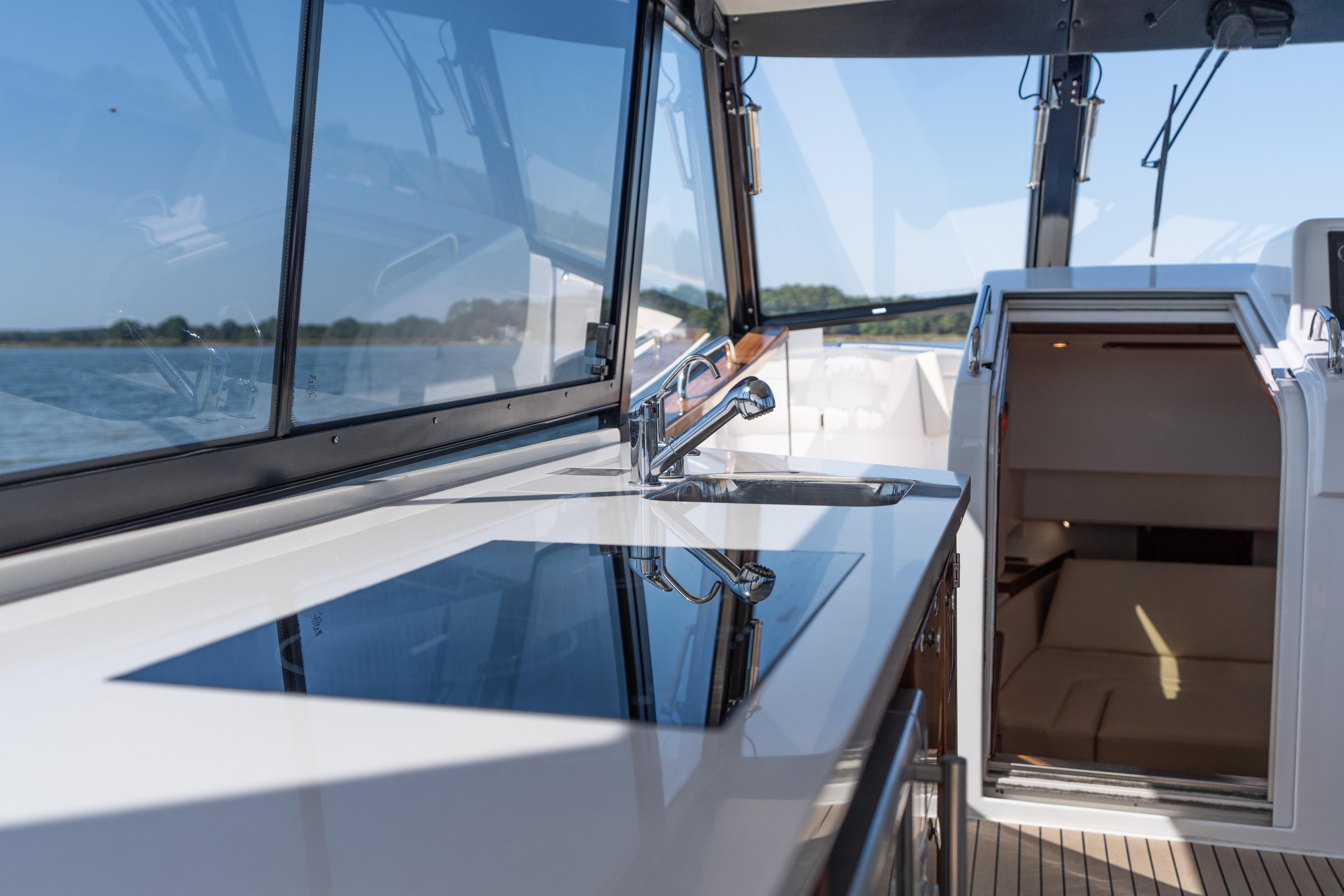 2023 MJM Yachts 4 interior with sleek kitchen and open cabin view.