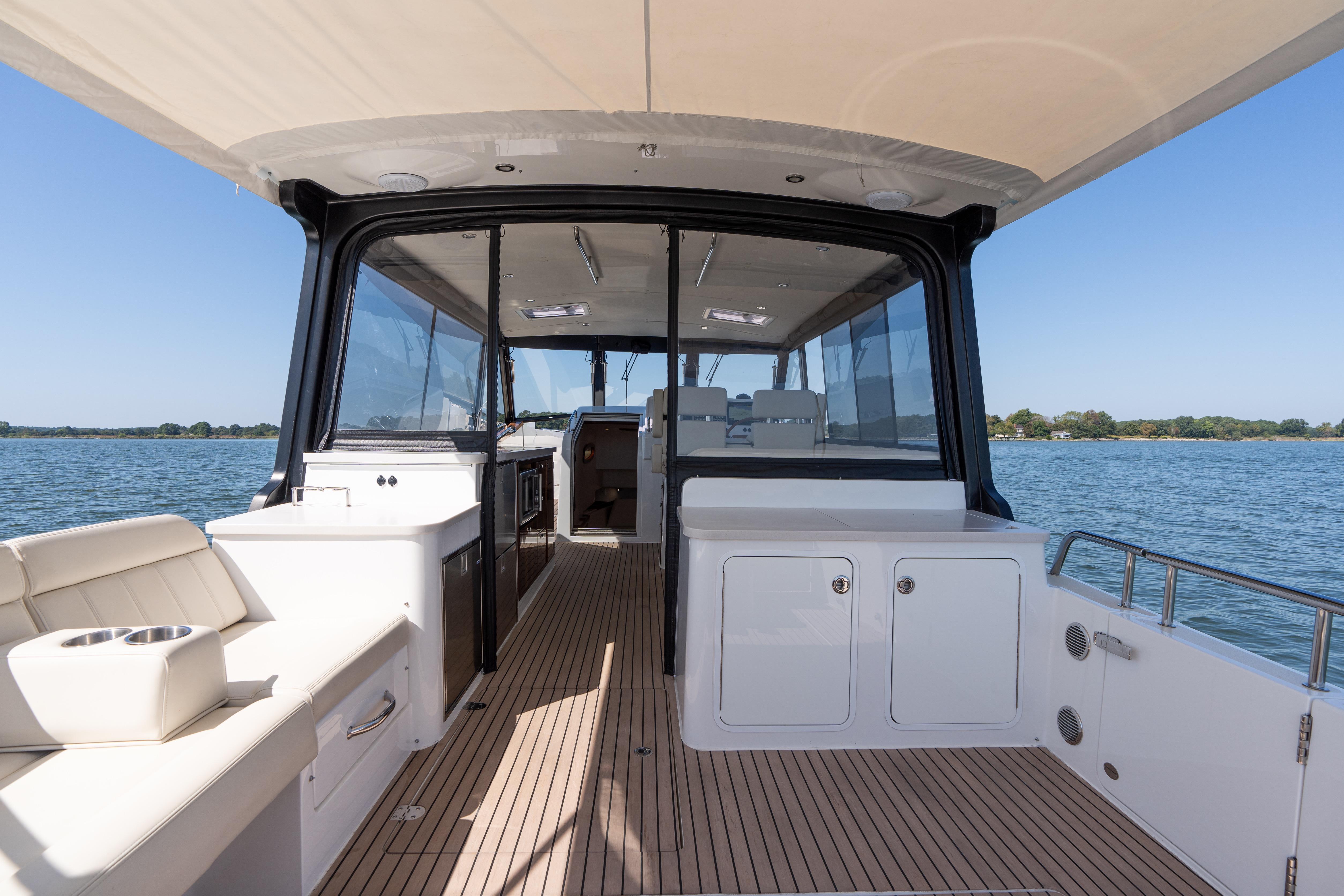 2023 MJM Yachts 4 interior with sleek design and spacious deck on calm waters.
