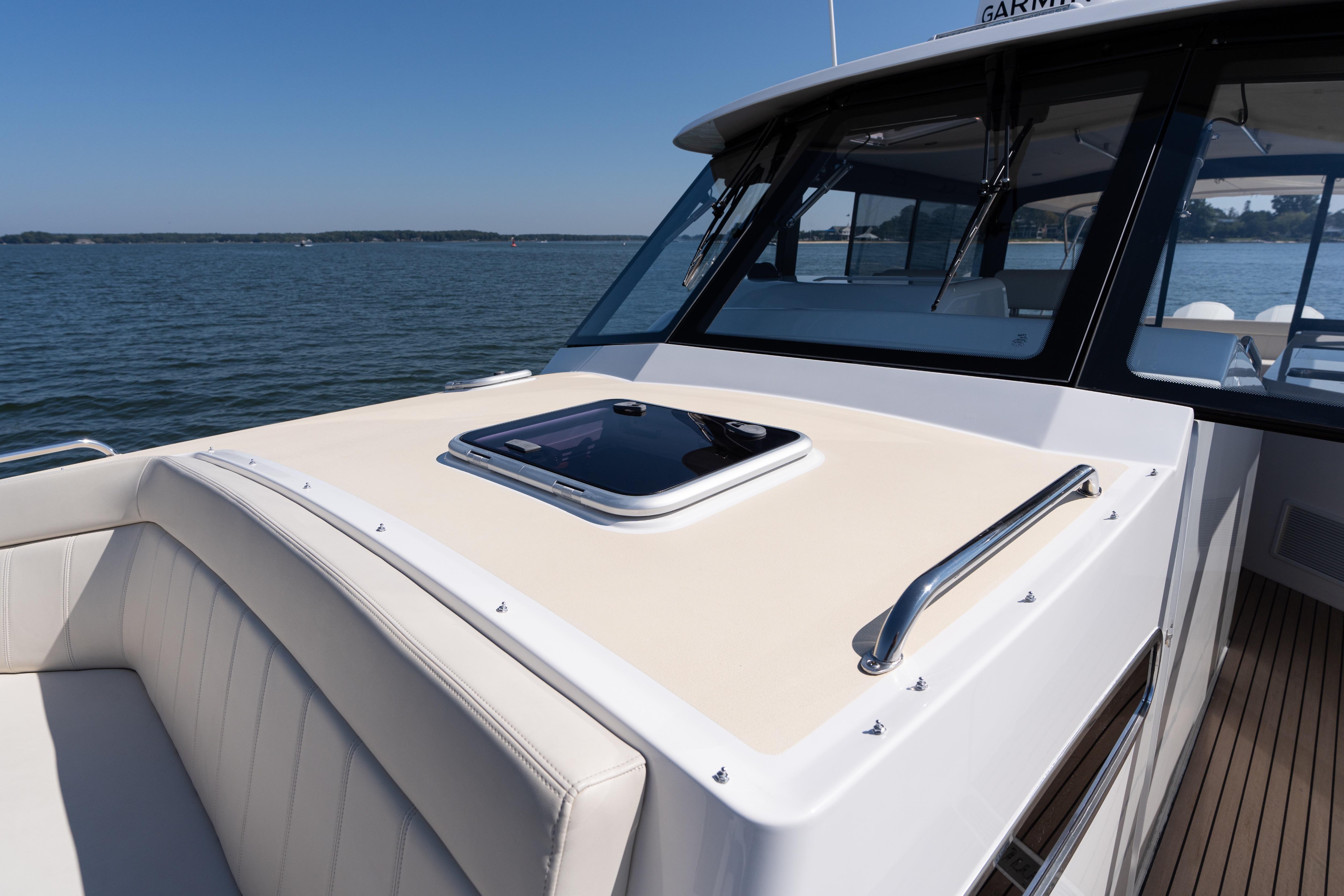 2023 MJM Yachts 4 model, featuring sleek deck design and luxurious seating on open water.