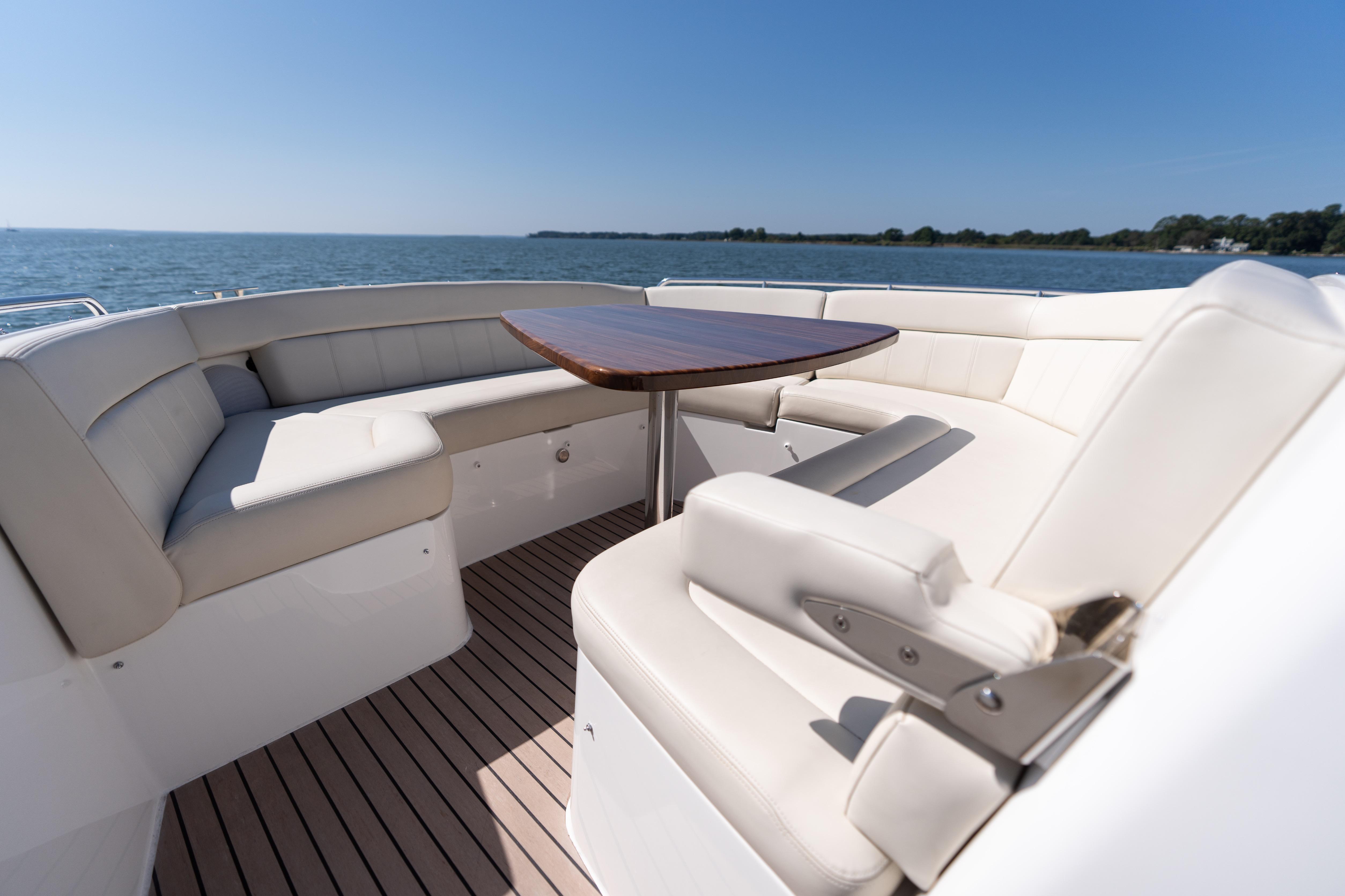 Luxurious seating area on 2023 MJM Yachts 4, overlooking serene ocean view.